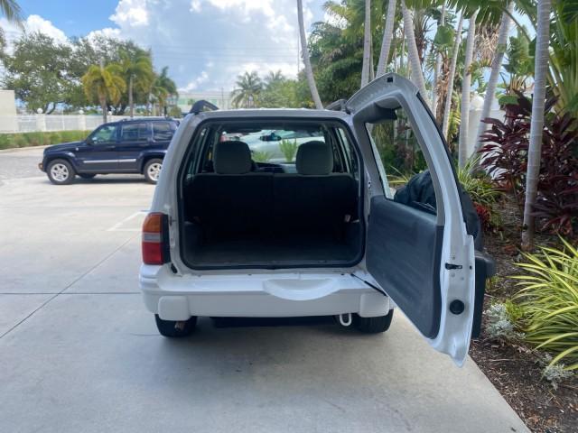 2001 Bright White /Gray Suzuki Vitara JLS LOW 35,130 1 OWNER (2S3TE52V716) with an 2.0L DOHC MPFI 16-Valve 4-Cyl Engine engine, Automatic transmission, located at 4701 North Dixie Hwy, Pompano Beach, FL, 33064, (954) 422-2889, 26.240938, -80.123474 - OUR WEBPAGE FLORIDACARS1.COM HAS OVER 100 PHOTOS AND FREE CARFAX LINK 2001 SUZUKI VITARA JLS VIN: 2S3TE52V716105780 2 S 3 T E 5 2 V 7 1 6 1 0 5 7 8 0 4 DOOR WAGON/SPORT UTILITY 2.0L I4 F DOHC 16V GASOLINE REAR WHEEL DRIVE Top Features Cloth Seats Soft Top Basic Features AM/FM Stereo Air Conditioning - Photo#77