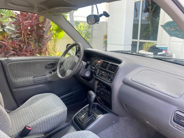 2001 Bright White /Gray Suzuki Vitara JLS LOW 35,130 1 OWNER (2S3TE52V716) with an 2.0L DOHC MPFI 16-Valve 4-Cyl Engine engine, Automatic transmission, located at 4701 North Dixie Hwy, Pompano Beach, FL, 33064, (954) 422-2889, 26.240938, -80.123474 - OUR WEBPAGE FLORIDACARS1.COM HAS OVER 100 PHOTOS AND FREE CARFAX LINK 2001 SUZUKI VITARA JLS VIN: 2S3TE52V716105780 2 S 3 T E 5 2 V 7 1 6 1 0 5 7 8 0 4 DOOR WAGON/SPORT UTILITY 2.0L I4 F DOHC 16V GASOLINE REAR WHEEL DRIVE Top Features Cloth Seats Soft Top Basic Features AM/FM Stereo Air Conditioning - Photo#96