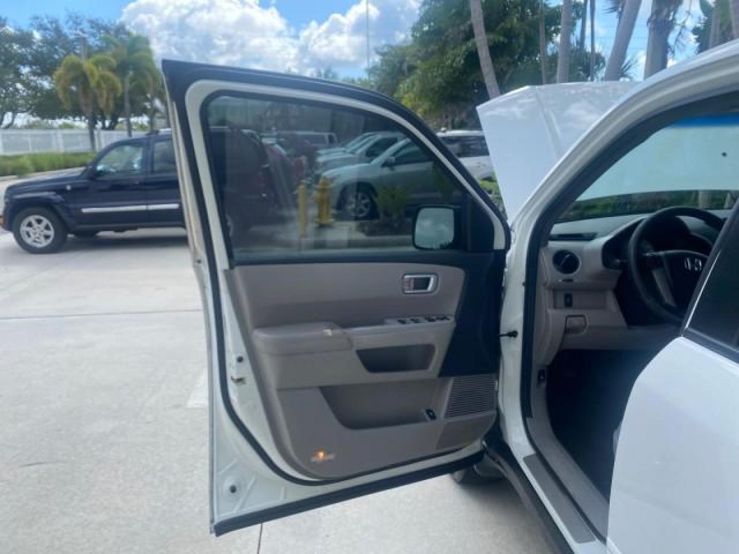 2011 Taffeta White /Gray Honda Pilot EX-L FL LOW MILES 93,295 (5FNYF3H58BB) with an 3.5L SOHC MPFI 24-Valve i-VTEC V6 Engine engine, Automatic transmission, located at 4701 North Dixie Hwy, Pompano Beach, FL, 33064, (954) 422-2889, 26.240938, -80.123474 - OUR WEBPAGE FLORIDACARS1.COM HAS OVER 100 PHOTOS AND FREE CARFAX LINK 2011 HONDA PILOT EX-L VIN: 5FNYF3H58BB048398 5 F N Y F 3 H 5 8 B B 0 4 8 3 9 8 4 DOOR WAGON/SPORT UTILITY 3.5L V6 F SOHC 24V GASOLINE FRONT WHEEL DRIVE Features ABS Brakes Air Conditioning Alloy Wheels AM/FM Stereo Automatic Trans - Photo#9