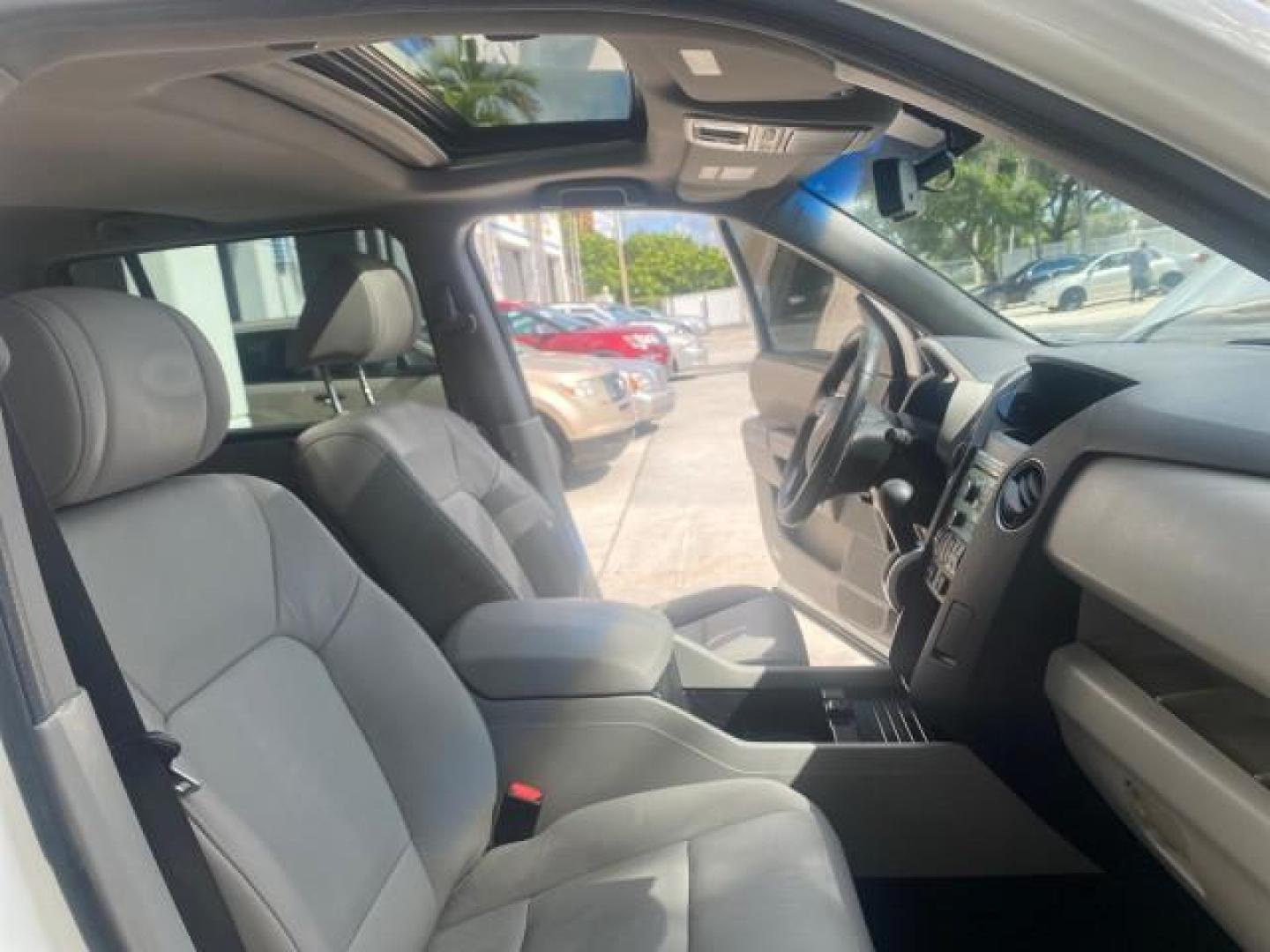 2011 Taffeta White /Gray Honda Pilot EX-L FL LOW MILES 93,295 (5FNYF3H58BB) with an 3.5L SOHC MPFI 24-Valve i-VTEC V6 Engine engine, Automatic transmission, located at 4701 North Dixie Hwy, Pompano Beach, FL, 33064, (954) 422-2889, 26.240938, -80.123474 - OUR WEBPAGE FLORIDACARS1.COM HAS OVER 100 PHOTOS AND FREE CARFAX LINK 2011 HONDA PILOT EX-L VIN: 5FNYF3H58BB048398 5 F N Y F 3 H 5 8 B B 0 4 8 3 9 8 4 DOOR WAGON/SPORT UTILITY 3.5L V6 F SOHC 24V GASOLINE FRONT WHEEL DRIVE Features ABS Brakes Air Conditioning Alloy Wheels AM/FM Stereo Automatic Trans - Photo#12