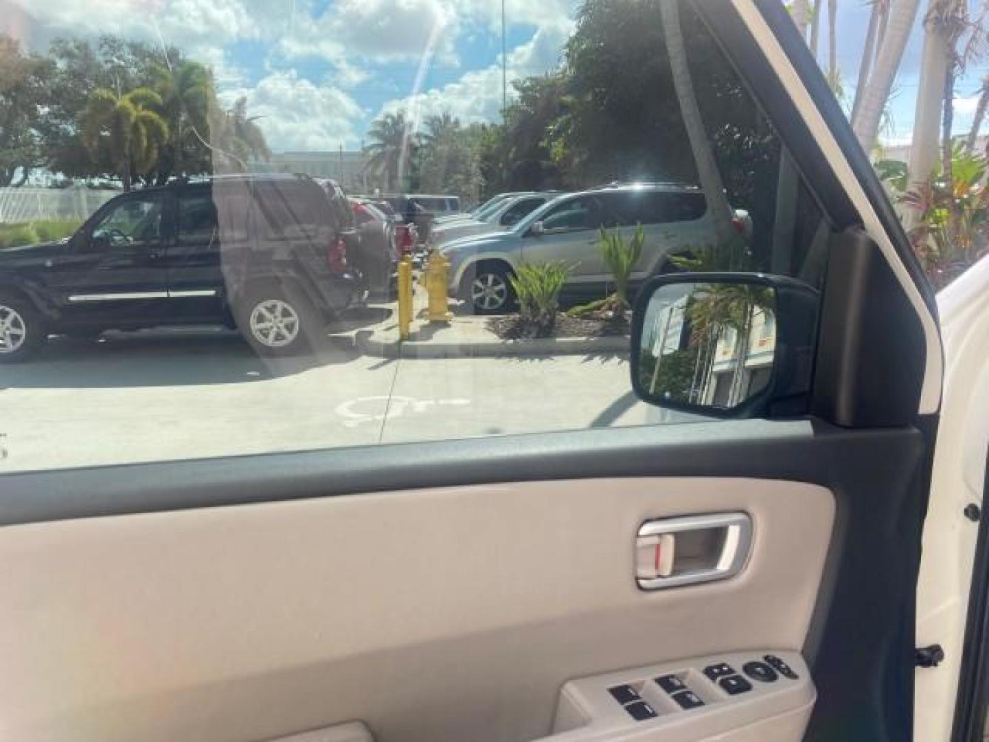 2011 Taffeta White /Gray Honda Pilot EX-L FL LOW MILES 93,295 (5FNYF3H58BB) with an 3.5L SOHC MPFI 24-Valve i-VTEC V6 Engine engine, Automatic transmission, located at 4701 North Dixie Hwy, Pompano Beach, FL, 33064, (954) 422-2889, 26.240938, -80.123474 - OUR WEBPAGE FLORIDACARS1.COM HAS OVER 100 PHOTOS AND FREE CARFAX LINK 2011 HONDA PILOT EX-L VIN: 5FNYF3H58BB048398 5 F N Y F 3 H 5 8 B B 0 4 8 3 9 8 4 DOOR WAGON/SPORT UTILITY 3.5L V6 F SOHC 24V GASOLINE FRONT WHEEL DRIVE Features ABS Brakes Air Conditioning Alloy Wheels AM/FM Stereo Automatic Trans - Photo#31