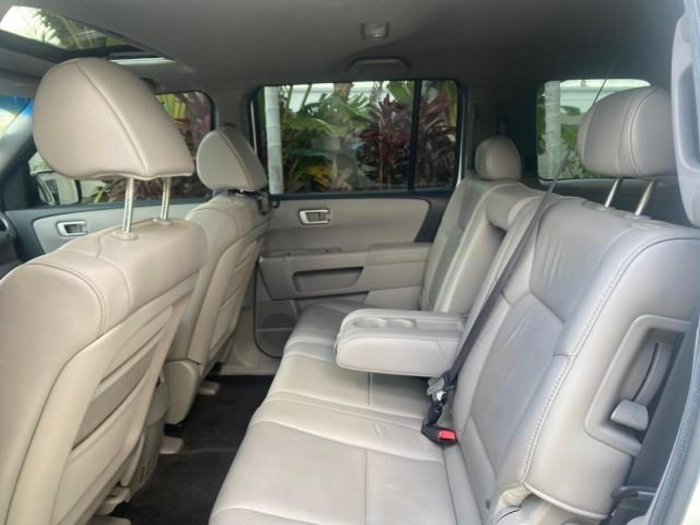 2011 Taffeta White /Gray Honda Pilot EX-L FL LOW MILES 93,295 (5FNYF3H58BB) with an 3.5L SOHC MPFI 24-Valve i-VTEC V6 Engine engine, Automatic transmission, located at 4701 North Dixie Hwy, Pompano Beach, FL, 33064, (954) 422-2889, 26.240938, -80.123474 - OUR WEBPAGE FLORIDACARS1.COM HAS OVER 100 PHOTOS AND FREE CARFAX LINK 2011 HONDA PILOT EX-L VIN: 5FNYF3H58BB048398 5 F N Y F 3 H 5 8 B B 0 4 8 3 9 8 4 DOOR WAGON/SPORT UTILITY 3.5L V6 F SOHC 24V GASOLINE FRONT WHEEL DRIVE Features ABS Brakes Air Conditioning Alloy Wheels AM/FM Stereo Automatic Trans - Photo#74