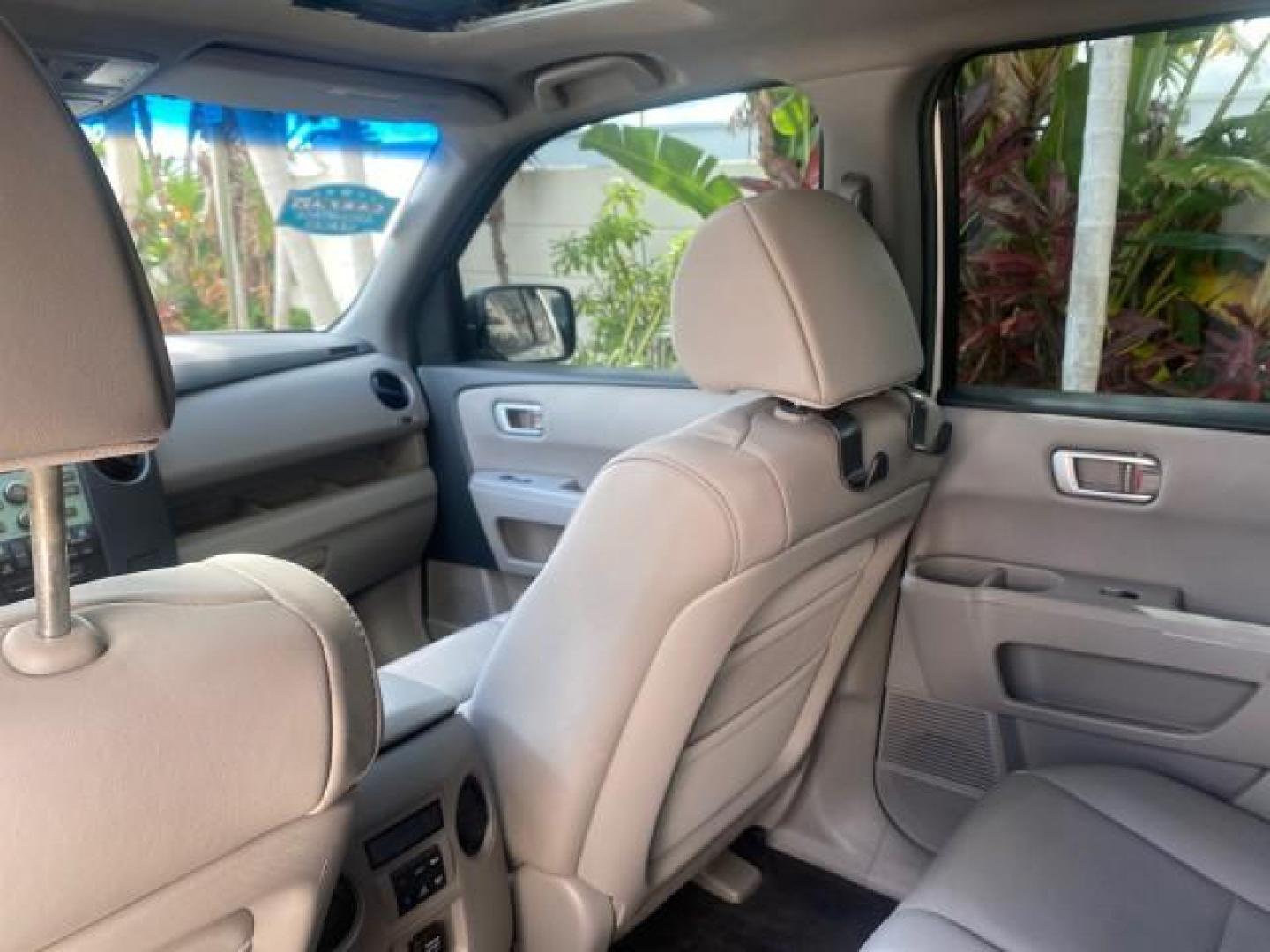 2011 Taffeta White /Gray Honda Pilot EX-L FL LOW MILES 93,295 (5FNYF3H58BB) with an 3.5L SOHC MPFI 24-Valve i-VTEC V6 Engine engine, Automatic transmission, located at 4701 North Dixie Hwy, Pompano Beach, FL, 33064, (954) 422-2889, 26.240938, -80.123474 - OUR WEBPAGE FLORIDACARS1.COM HAS OVER 100 PHOTOS AND FREE CARFAX LINK 2011 HONDA PILOT EX-L VIN: 5FNYF3H58BB048398 5 F N Y F 3 H 5 8 B B 0 4 8 3 9 8 4 DOOR WAGON/SPORT UTILITY 3.5L V6 F SOHC 24V GASOLINE FRONT WHEEL DRIVE Features ABS Brakes Air Conditioning Alloy Wheels AM/FM Stereo Automatic Trans - Photo#81