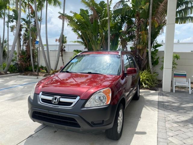 2003 Chianti Red Pearl /Saddle Honda CR-V EX 4WD NICE CLEAN SUNROOF (JHLRD78843C) with an 2.4L DOHC i-VTEC 16-Valve I4 Engine engine, Automatic transmission, located at 4701 North Dixie Hwy, Pompano Beach, FL, 33064, (954) 422-2889, 26.240938, -80.123474 - OUR WEBPAGE FLORIDACARS1.COM HAS OVER 100 PHOTOS AND FREE CARFAX LINK 2003 HONDA CR-V EX VIN: JHLRD78843C024323 J H L R D 7 8 8 4 3 C 0 2 4 3 2 3 4 DOOR WAGON/SPORT UTILITY 2.4L I4 F DOHC GASOLINE ALL WHEEL DRIVE Basic Features ABS Brakes AM/FM Stereo Air Conditioning Automatic Transmission Sunroof - Photo#3