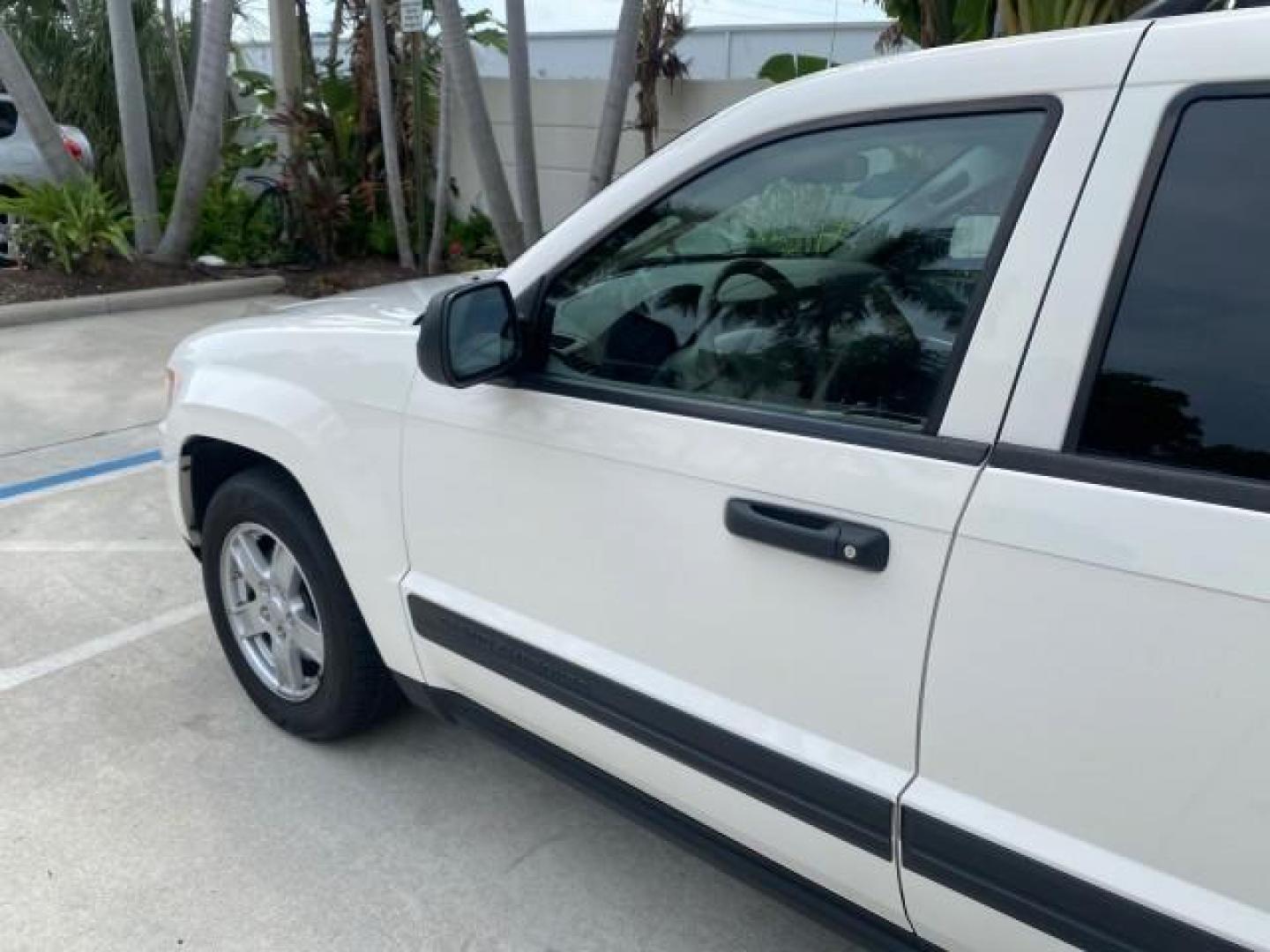 2005 Stone White /Medium Slate Gray Jeep Grand Cherokee Laredo LOW MILES 61,347 (1J4GS48K85C) with an 3.7L V6 Power Tech Engine engine, Automatic transmission, located at 4701 North Dixie Hwy, Pompano Beach, FL, 33064, (954) 422-2889, 26.240938, -80.123474 - OUR WEBPAGE FLORIDACARS1.COM HAS OVER 100 PHOTOS AND FREE CARFAX LINK 2005 JEEP GRAND CHEROKEE LAREDO VIN: 1J4GS48K85C634226 1 J 4 G S 4 8 K 8 5 C 6 3 4 2 2 6 4 DOOR WAGON/SPORT UTILITY 3.7L V6 F GASOLINE REAR WHEEL DRIVE Features ABS Brakes Air Conditioning Alloy Wheels AM/FM Stereo Automatic Trans - Photo#27