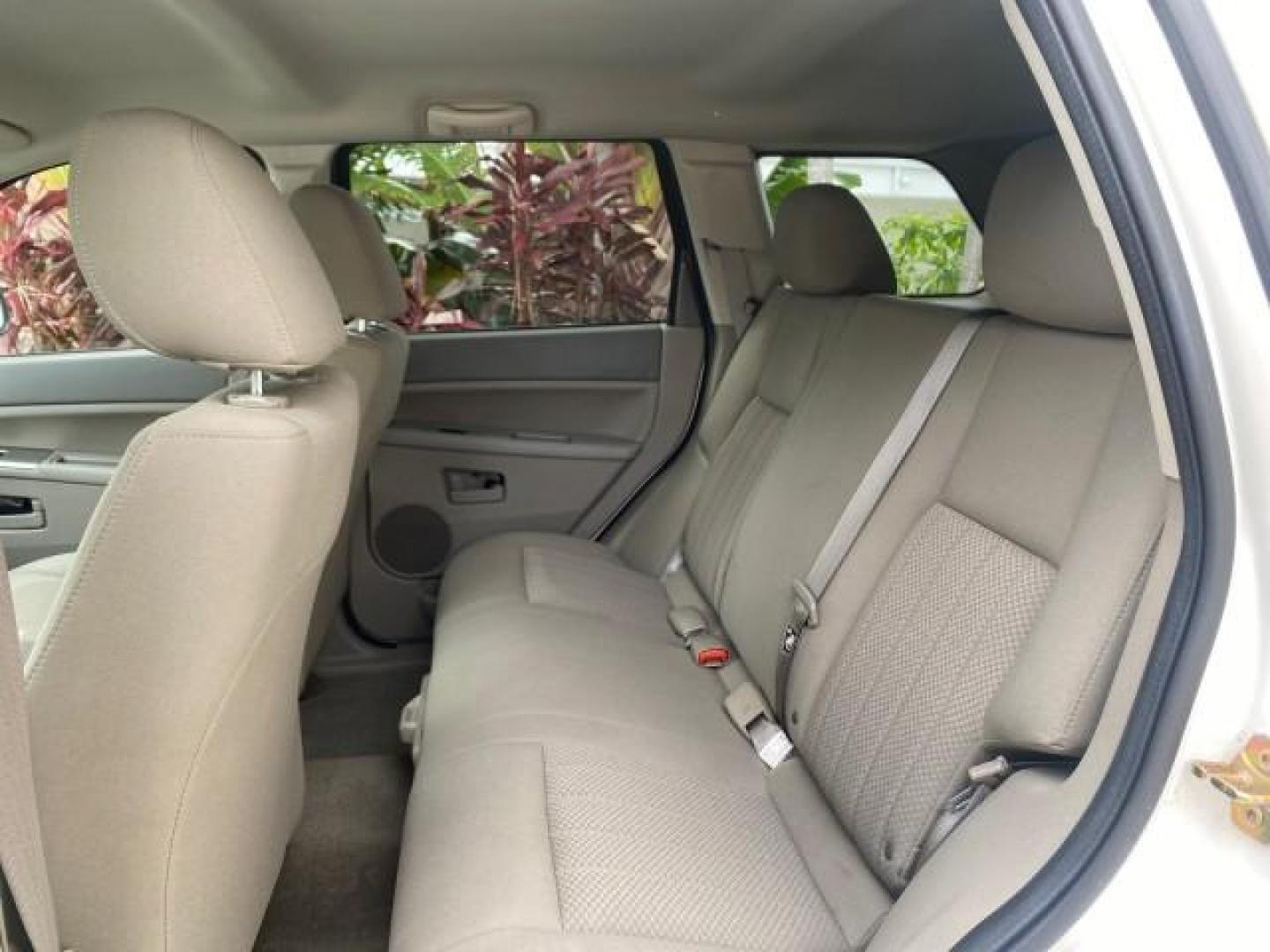 2005 Stone White /Medium Slate Gray Jeep Grand Cherokee Laredo LOW MILES 61,347 (1J4GS48K85C) with an 3.7L V6 Power Tech Engine engine, Automatic transmission, located at 4701 North Dixie Hwy, Pompano Beach, FL, 33064, (954) 422-2889, 26.240938, -80.123474 - OUR WEBPAGE FLORIDACARS1.COM HAS OVER 100 PHOTOS AND FREE CARFAX LINK 2005 JEEP GRAND CHEROKEE LAREDO VIN: 1J4GS48K85C634226 1 J 4 G S 4 8 K 8 5 C 6 3 4 2 2 6 4 DOOR WAGON/SPORT UTILITY 3.7L V6 F GASOLINE REAR WHEEL DRIVE Features ABS Brakes Air Conditioning Alloy Wheels AM/FM Stereo Automatic Trans - Photo#64