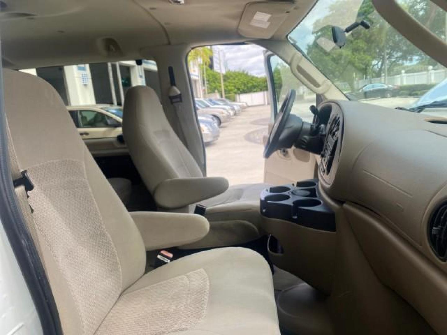 2006 Oxford White /Medium Flint Ford Econoline Wagon XLT LOW MILES 27,333 8 PASS (1FMRE11L86D) with an 5.4L EFI V8 Engine engine, Automatic transmission, located at 4701 North Dixie Hwy, Pompano Beach, FL, 33064, (954) 422-2889, 26.240938, -80.123474 - OUR WEBPAGE FLORIDACARS1.COM HAS OVER 100 PHOTOS AND FREE CARFAX LINK 2006 FORD E-SERIES E-150 XL - DUAL AIR 8 PASSENGER XL VIN: 1FMRE11L86DA99672 1 F M R E 1 1 L 8 6 D A 9 9 6 7 2 VAN 5.4L V8 F GASOLINE REAR WHEEL DRIVE Features ABS Brakes Air Conditioning AM/FM Stereo Automatic Transmission Runnin - Photo#12