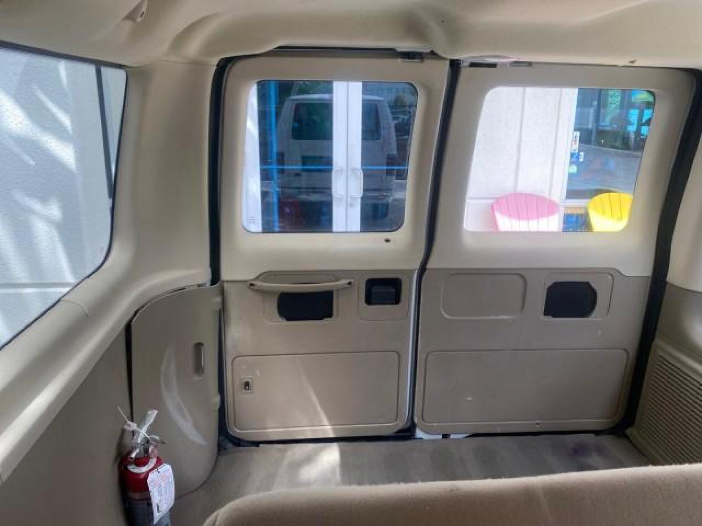 2006 Oxford White /Medium Flint Ford Econoline Wagon XLT LOW MILES 27,333 8 PASS (1FMRE11L86D) with an 5.4L EFI V8 Engine engine, Automatic transmission, located at 4701 North Dixie Hwy, Pompano Beach, FL, 33064, (954) 422-2889, 26.240938, -80.123474 - OUR WEBPAGE FLORIDACARS1.COM HAS OVER 100 PHOTOS AND FREE CARFAX LINK 2006 FORD E-SERIES E-150 XL - DUAL AIR 8 PASSENGER XL VIN: 1FMRE11L86DA99672 1 F M R E 1 1 L 8 6 D A 9 9 6 7 2 VAN 5.4L V8 F GASOLINE REAR WHEEL DRIVE Features ABS Brakes Air Conditioning AM/FM Stereo Automatic Transmission Runnin - Photo#75