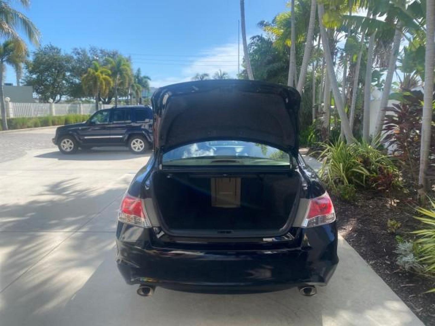 2010 Crystal Black Pearl /Ivory Honda Accord Sdn EX-L LOW MILES 68,158 (1HGCP3F8XAA) with an 3.5L SOHC MPFI 24-Valve i-VTEC V6 Engine engine, Automatic transmission, located at 4701 North Dixie Hwy, Pompano Beach, FL, 33064, (954) 422-2889, 26.240938, -80.123474 - OUR WEBPAGE FLORIDACARS1.COM HAS OVER 100 PHOTOS AND FREE CARFAX LINK 2010 HONDA ACCORD EX-L V6 VIN: 1HGCP3F8XAA027761 1 H G C P 3 F 8 X A A 0 2 7 7 6 1 SEDAN 4 DR 3.5L V6 F SOHC 24V GASOLINE FRONT WHEEL DRIVE Features ABS Brakes Air Conditioning Alloy Wheels AM/FM Stereo Automatic Transmission Auxi - Photo#85