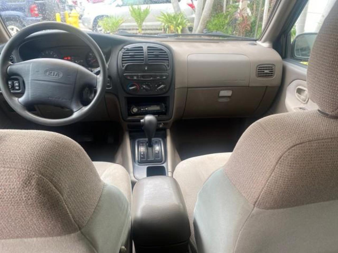 2002 White /Gray Kia Sportage SUV LOW MILES 37,679 (KNDJB723325) with an 2.0L DOHC MPFI 16-Valve Inline 4-Cyl Engine engine, Automatic transmission, located at 4701 North Dixie Hwy, Pompano Beach, FL, 33064, (954) 422-2889, 26.240938, -80.123474 - OUR WEBPAGE FLORIDACARS1.COM HAS OVER 100 PHOTOS AND FREE CARFAX LINK 2002 KIA SPORTAGE VIN: KNDJB723325123795 K N D J B 7 2 3 3 2 5 1 2 3 7 9 5 4 DOOR WAGON/SPORT UTILITY 2.0L I4 F DOHC 16V GASOLINE REAR WHEEL DRIVE Features Air Conditioning Alloy Wheels AM/FM Stereo Automatic Transmission CD Audio - Photo#63