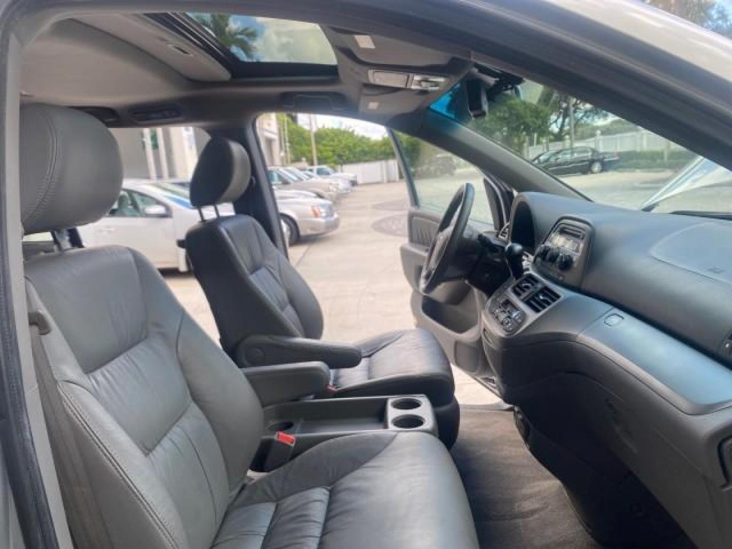 2010 Slate Green Metallic /Gray Honda Odyssey EX-L LOW MILES 52,543 1 OWNER FL (5FNRL3H62AB) with an 3.5L SOHC MPFI 24-Valve i-VTEC V6 Engine engine, Automatic transmission, located at 4701 North Dixie Hwy, Pompano Beach, FL, 33064, (954) 422-2889, 26.240938, -80.123474 - OUR WEBPAGE FLORIDACARS1.COM HAS OVER 100 PHOTOS AND FREE CARFAX LINK 2010 HONDA ODYSSEY EX-L VIN: 5FNRL3H62AB112651 5 F N R L 3 H 6 2 A B 1 1 2 6 5 1 VAN 3.5L V6 F SOHC 24V GASOLINE FRONT WHEEL DRIVE Features ABS Brakes Air Conditioning Alloy Wheels AM/FM Stereo Automatic Transmission Auxiliary Aud - Photo#12