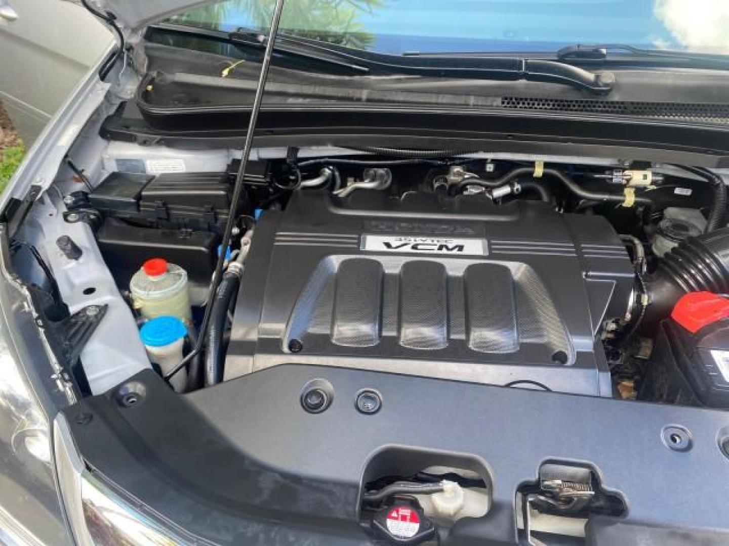 2010 Slate Green Metallic /Gray Honda Odyssey EX-L LOW MILES 52,543 1 OWNER FL (5FNRL3H62AB) with an 3.5L SOHC MPFI 24-Valve i-VTEC V6 Engine engine, Automatic transmission, located at 4701 North Dixie Hwy, Pompano Beach, FL, 33064, (954) 422-2889, 26.240938, -80.123474 - OUR WEBPAGE FLORIDACARS1.COM HAS OVER 100 PHOTOS AND FREE CARFAX LINK 2010 HONDA ODYSSEY EX-L VIN: 5FNRL3H62AB112651 5 F N R L 3 H 6 2 A B 1 1 2 6 5 1 VAN 3.5L V6 F SOHC 24V GASOLINE FRONT WHEEL DRIVE Features ABS Brakes Air Conditioning Alloy Wheels AM/FM Stereo Automatic Transmission Auxiliary Aud - Photo#25