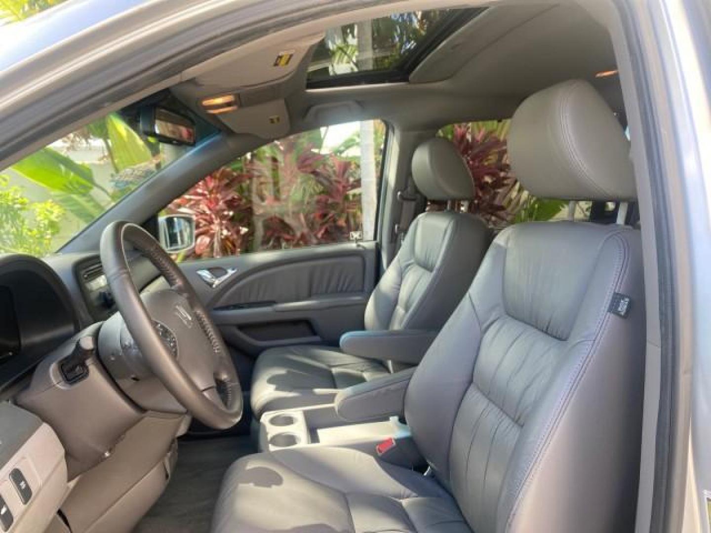 2010 Slate Green Metallic /Gray Honda Odyssey EX-L LOW MILES 52,543 1 OWNER FL (5FNRL3H62AB) with an 3.5L SOHC MPFI 24-Valve i-VTEC V6 Engine engine, Automatic transmission, located at 4701 North Dixie Hwy, Pompano Beach, FL, 33064, (954) 422-2889, 26.240938, -80.123474 - OUR WEBPAGE FLORIDACARS1.COM HAS OVER 100 PHOTOS AND FREE CARFAX LINK 2010 HONDA ODYSSEY EX-L VIN: 5FNRL3H62AB112651 5 F N R L 3 H 6 2 A B 1 1 2 6 5 1 VAN 3.5L V6 F SOHC 24V GASOLINE FRONT WHEEL DRIVE Features ABS Brakes Air Conditioning Alloy Wheels AM/FM Stereo Automatic Transmission Auxiliary Aud - Photo#35