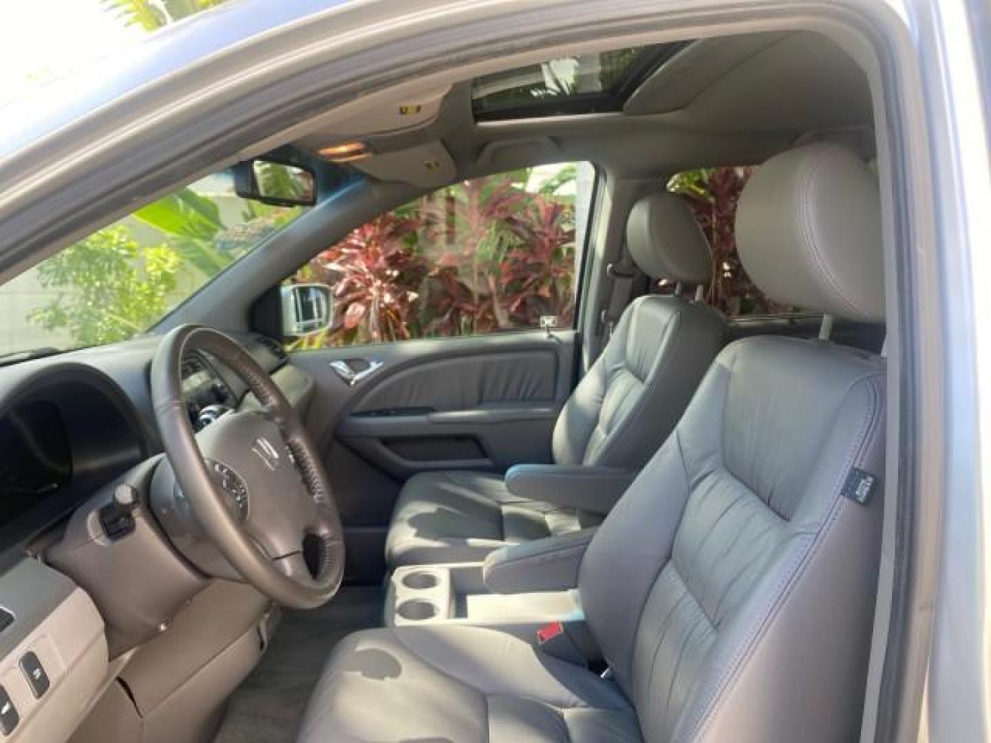 2010 Slate Green Metallic /Gray Honda Odyssey EX-L LOW MILES 52,543 1 OWNER FL (5FNRL3H62AB) with an 3.5L SOHC MPFI 24-Valve i-VTEC V6 Engine engine, Automatic transmission, located at 4701 North Dixie Hwy, Pompano Beach, FL, 33064, (954) 422-2889, 26.240938, -80.123474 - OUR WEBPAGE FLORIDACARS1.COM HAS OVER 100 PHOTOS AND FREE CARFAX LINK 2010 HONDA ODYSSEY EX-L VIN: 5FNRL3H62AB112651 5 F N R L 3 H 6 2 A B 1 1 2 6 5 1 VAN 3.5L V6 F SOHC 24V GASOLINE FRONT WHEEL DRIVE Features ABS Brakes Air Conditioning Alloy Wheels AM/FM Stereo Automatic Transmission Auxiliary Aud - Photo#36