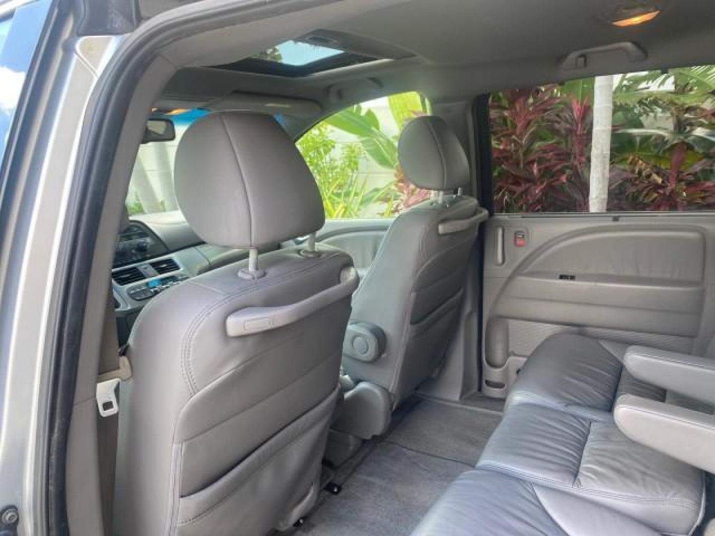2010 Slate Green Metallic /Gray Honda Odyssey EX-L LOW MILES 52,543 1 OWNER FL (5FNRL3H62AB) with an 3.5L SOHC MPFI 24-Valve i-VTEC V6 Engine engine, Automatic transmission, located at 4701 North Dixie Hwy, Pompano Beach, FL, 33064, (954) 422-2889, 26.240938, -80.123474 - OUR WEBPAGE FLORIDACARS1.COM HAS OVER 100 PHOTOS AND FREE CARFAX LINK 2010 HONDA ODYSSEY EX-L VIN: 5FNRL3H62AB112651 5 F N R L 3 H 6 2 A B 1 1 2 6 5 1 VAN 3.5L V6 F SOHC 24V GASOLINE FRONT WHEEL DRIVE Features ABS Brakes Air Conditioning Alloy Wheels AM/FM Stereo Automatic Transmission Auxiliary Aud - Photo#73