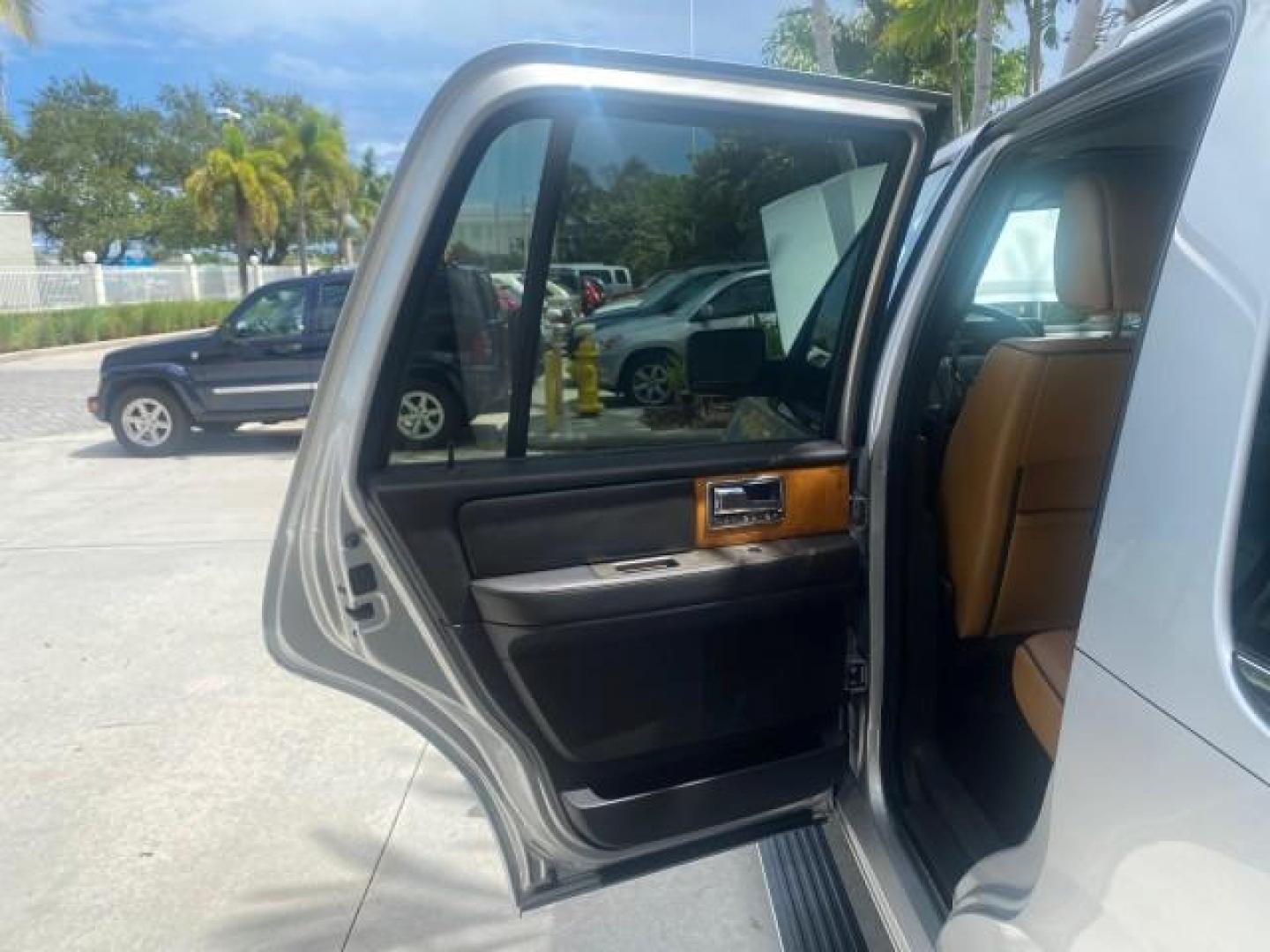 2011 White Platinum Tri-Coat Metallic /Stone Lincoln Navigator 1 OWNER FLORIDA SUNROOF (5LMJJ2H50BE) with an 5.4L SOHC 24-Valve V8 FFV Engine engine, Automatic transmission, located at 4701 North Dixie Hwy, Pompano Beach, FL, 33064, (954) 422-2889, 26.240938, -80.123474 - OUR WEBPAGE FLORIDACARS1.COM HAS OVER 100 PHOTOS AND FREE CARFAX LINK 2011 LINCOLN NAVIGATOR VIN: 5LMJJ2H50BEJ08212 5 L M J J 2 H 5 0 B E J 0 8 2 1 2 4 DOOR WAGON/SPORT UTILITY 5.4L V8 F SOHC 24V FLEX FUEL REAR WHEEL DRIVE Features A/C Seat(s) ABS Brakes Air Conditioning Alloy Wheels AM/FM Stereo Au - Photo#13