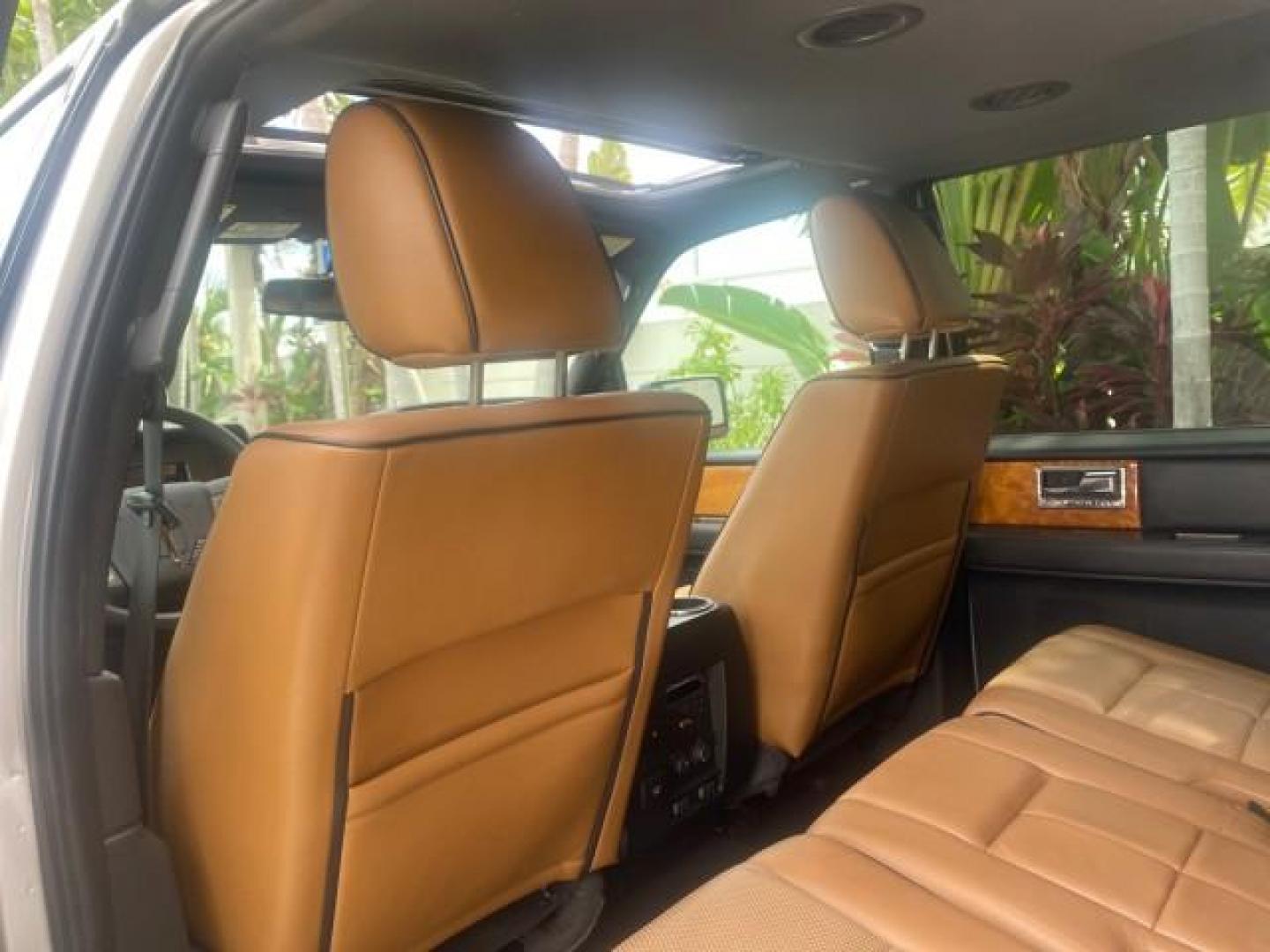 2011 White Platinum Tri-Coat Metallic /Stone Lincoln Navigator 1 OWNER FLORIDA SUNROOF (5LMJJ2H50BE) with an 5.4L SOHC 24-Valve V8 FFV Engine engine, Automatic transmission, located at 4701 North Dixie Hwy, Pompano Beach, FL, 33064, (954) 422-2889, 26.240938, -80.123474 - OUR WEBPAGE FLORIDACARS1.COM HAS OVER 100 PHOTOS AND FREE CARFAX LINK 2011 LINCOLN NAVIGATOR VIN: 5LMJJ2H50BEJ08212 5 L M J J 2 H 5 0 B E J 0 8 2 1 2 4 DOOR WAGON/SPORT UTILITY 5.4L V8 F SOHC 24V FLEX FUEL REAR WHEEL DRIVE Features A/C Seat(s) ABS Brakes Air Conditioning Alloy Wheels AM/FM Stereo Au - Photo#69