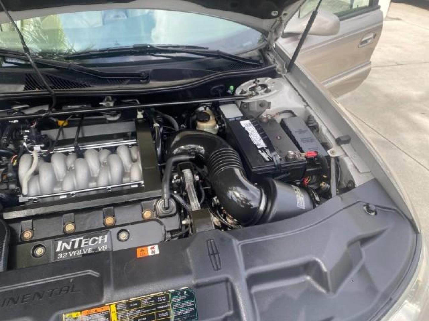 2002 Lt Parchment Gold Metallic /Light Graphite Lincoln Continental LOW MILES 60,071 1 OWNER FLORIDA (1LNHM97V12Y) with an 4.6L DOHC 32-Valve V8 Intech Engine engine, Automatic transmission, located at 4701 North Dixie Hwy, Pompano Beach, FL, 33064, (954) 422-2889, 26.240938, -80.123474 - OUR WEBPAGE FLORIDACARS1.COM HAS OVER 100 PHOTOS AND FREE CARFAX LINK 2002 LINCOLN CONTINENTAL VIN: 1LNHM97V12Y600863 1 L N H M 9 7 V 1 2 Y 6 0 0 8 6 3 SEDAN 4 DR 4.6L V8 F DOHC 32V GASOLINE FRONT WHEEL DRIVE Features ABS Brakes Air Conditioning Alloy Wheels AM/FM Stereo Automatic Transmission Casse - Photo#26