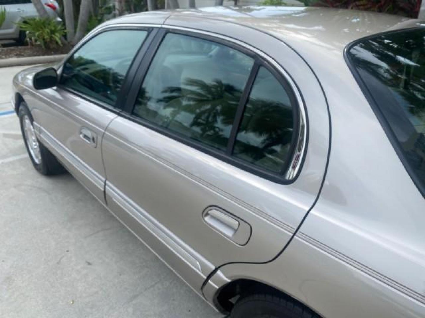 2002 Lt Parchment Gold Metallic /Light Graphite Lincoln Continental LOW MILES 60,071 1 OWNER FLORIDA (1LNHM97V12Y) with an 4.6L DOHC 32-Valve V8 Intech Engine engine, Automatic transmission, located at 4701 North Dixie Hwy, Pompano Beach, FL, 33064, (954) 422-2889, 26.240938, -80.123474 - OUR WEBPAGE FLORIDACARS1.COM HAS OVER 100 PHOTOS AND FREE CARFAX LINK 2002 LINCOLN CONTINENTAL VIN: 1LNHM97V12Y600863 1 L N H M 9 7 V 1 2 Y 6 0 0 8 6 3 SEDAN 4 DR 4.6L V8 F DOHC 32V GASOLINE FRONT WHEEL DRIVE Features ABS Brakes Air Conditioning Alloy Wheels AM/FM Stereo Automatic Transmission Casse - Photo#60