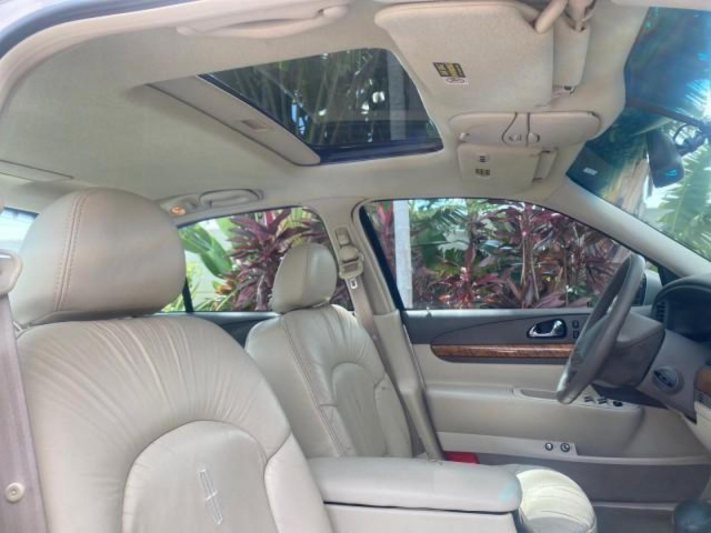 2002 Lt Parchment Gold Metallic /Light Graphite Lincoln Continental LOW MILES 60,071 1 OWNER FLORIDA (1LNHM97V12Y) with an 4.6L DOHC 32-Valve V8 Intech Engine engine, Automatic transmission, located at 4701 North Dixie Hwy, Pompano Beach, FL, 33064, (954) 422-2889, 26.240938, -80.123474 - OUR WEBPAGE FLORIDACARS1.COM HAS OVER 100 PHOTOS AND FREE CARFAX LINK 2002 LINCOLN CONTINENTAL VIN: 1LNHM97V12Y600863 1 L N H M 9 7 V 1 2 Y 6 0 0 8 6 3 SEDAN 4 DR 4.6L V8 F DOHC 32V GASOLINE FRONT WHEEL DRIVE Features ABS Brakes Air Conditioning Alloy Wheels AM/FM Stereo Automatic Transmission Casse - Photo#89