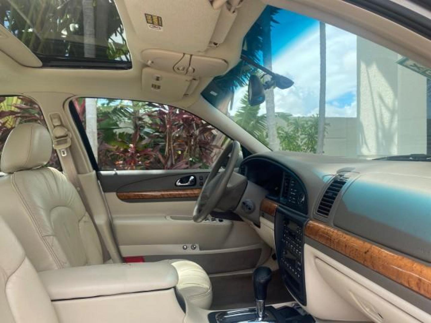 2002 Lt Parchment Gold Metallic /Light Graphite Lincoln Continental LOW MILES 60,071 1 OWNER FLORIDA (1LNHM97V12Y) with an 4.6L DOHC 32-Valve V8 Intech Engine engine, Automatic transmission, located at 4701 North Dixie Hwy, Pompano Beach, FL, 33064, (954) 422-2889, 26.240938, -80.123474 - OUR WEBPAGE FLORIDACARS1.COM HAS OVER 100 PHOTOS AND FREE CARFAX LINK 2002 LINCOLN CONTINENTAL VIN: 1LNHM97V12Y600863 1 L N H M 9 7 V 1 2 Y 6 0 0 8 6 3 SEDAN 4 DR 4.6L V8 F DOHC 32V GASOLINE FRONT WHEEL DRIVE Features ABS Brakes Air Conditioning Alloy Wheels AM/FM Stereo Automatic Transmission Casse - Photo#92
