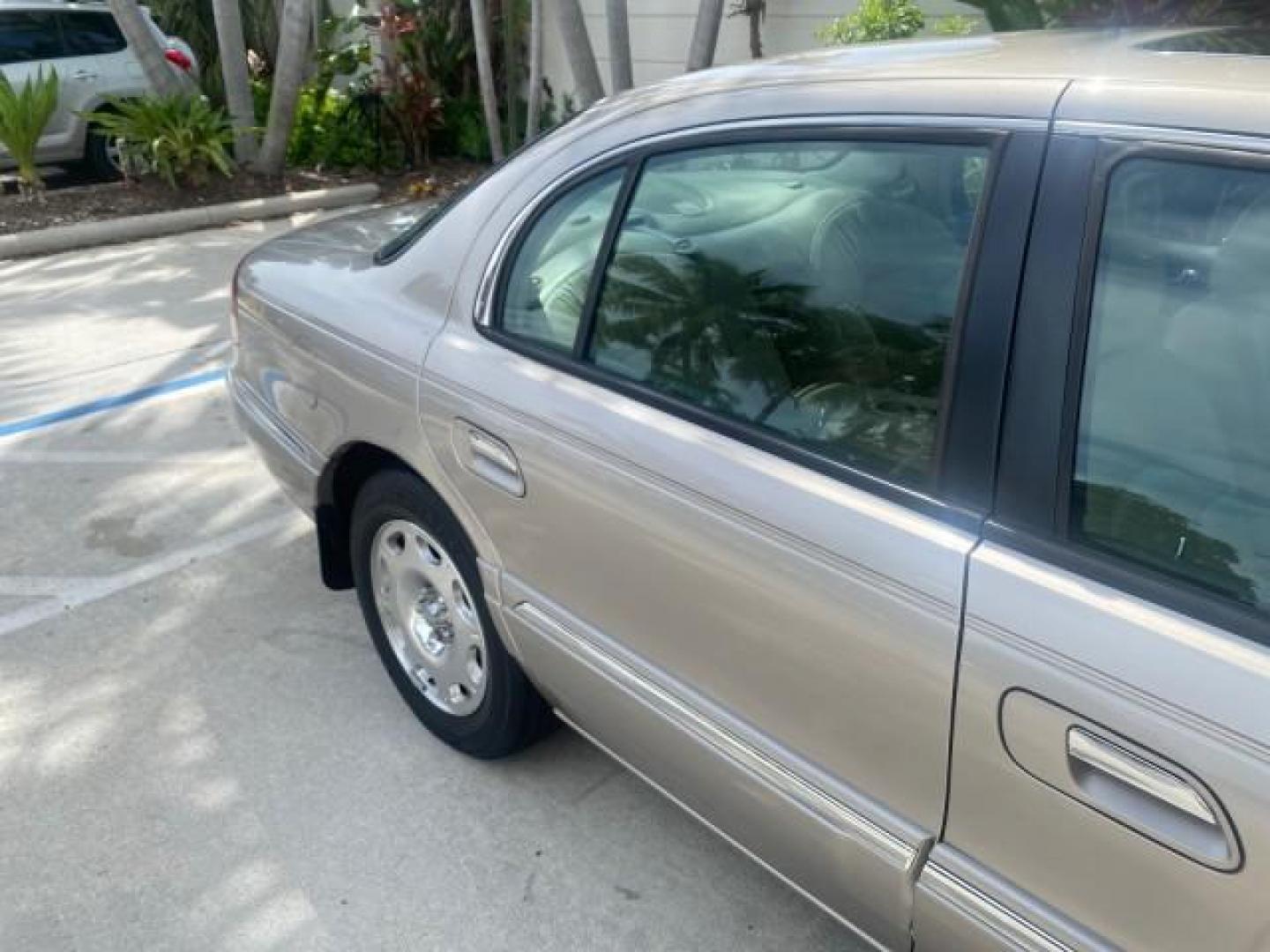 2002 Lt Parchment Gold Metallic /Light Graphite Lincoln Continental LOW MILES 60,071 1 OWNER FLORIDA (1LNHM97V12Y) with an 4.6L DOHC 32-Valve V8 Intech Engine engine, Automatic transmission, located at 4701 North Dixie Hwy, Pompano Beach, FL, 33064, (954) 422-2889, 26.240938, -80.123474 - OUR WEBPAGE FLORIDACARS1.COM HAS OVER 100 PHOTOS AND FREE CARFAX LINK 2002 LINCOLN CONTINENTAL VIN: 1LNHM97V12Y600863 1 L N H M 9 7 V 1 2 Y 6 0 0 8 6 3 SEDAN 4 DR 4.6L V8 F DOHC 32V GASOLINE FRONT WHEEL DRIVE Features ABS Brakes Air Conditioning Alloy Wheels AM/FM Stereo Automatic Transmission Casse - Photo#97