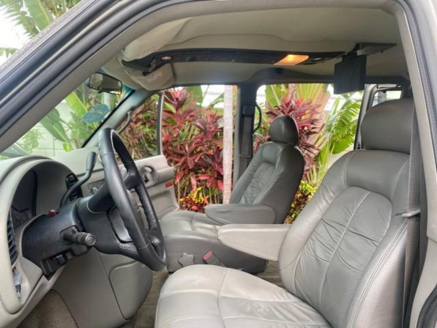 2004 Pewter Metallic /Medium Gray GMC Safari Passenger AWD LOW MILES 84,154 (1GKEL19X34B) with an 4.3L Vortec 4300 V6 MFI Engine engine, Automatic transmission, located at 4701 North Dixie Hwy, Pompano Beach, FL, 33064, (954) 422-2889, 26.240938, -80.123474 - OUR WEBPAGE FLORIDACARS1.COM HAS OVER 100 PHOTOS AND FREE CARFAX LINK 2004 GMC SAFARI VIN: 1GKEL19X34B502356 1 G K E L 1 9 X 3 4 B 5 0 2 3 5 6 VAN 4.3L V6 F GASOLINE ALL WHEEL DRIVE Features 4WD/AWD ABS Brakes Air Conditioning AM/FM Stereo Automatic Transmission Cassette Player CD Audio Convenience - Photo#10