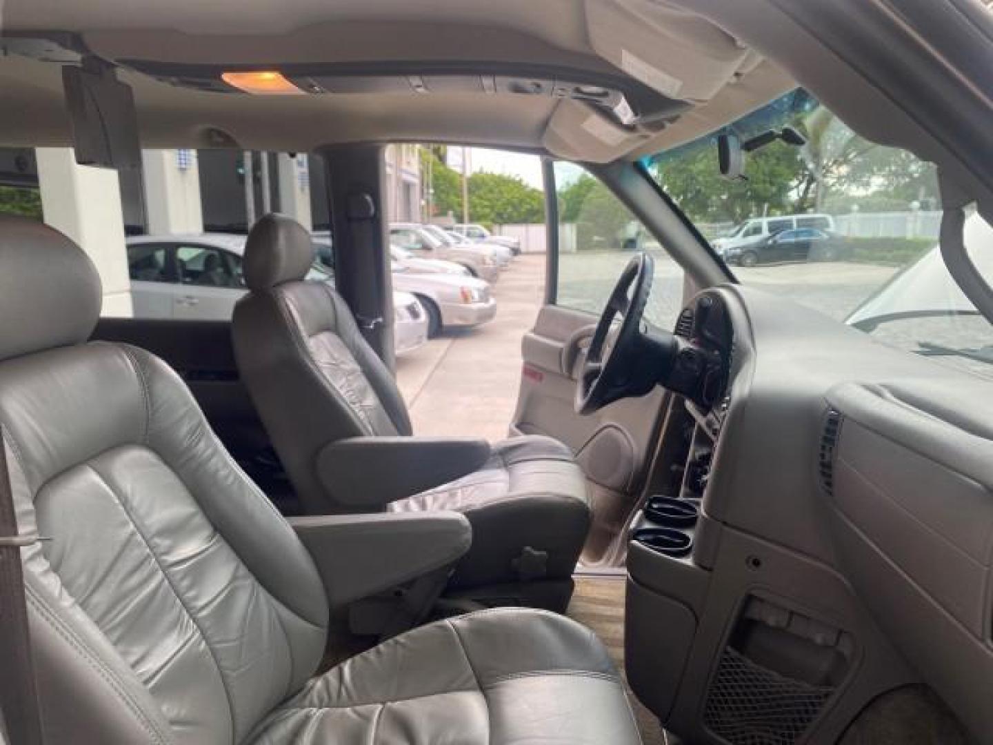 2004 Pewter Metallic /Medium Gray GMC Safari Passenger AWD LOW MILES 84,154 (1GKEL19X34B) with an 4.3L Vortec 4300 V6 MFI Engine engine, Automatic transmission, located at 4701 North Dixie Hwy, Pompano Beach, FL, 33064, (954) 422-2889, 26.240938, -80.123474 - OUR WEBPAGE FLORIDACARS1.COM HAS OVER 100 PHOTOS AND FREE CARFAX LINK 2004 GMC SAFARI VIN: 1GKEL19X34B502356 1 G K E L 1 9 X 3 4 B 5 0 2 3 5 6 VAN 4.3L V6 F GASOLINE ALL WHEEL DRIVE Features 4WD/AWD ABS Brakes Air Conditioning AM/FM Stereo Automatic Transmission Cassette Player CD Audio Convenience - Photo#12