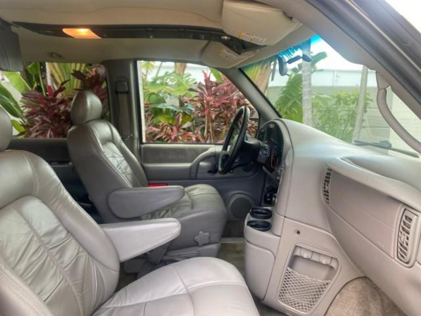 2004 Pewter Metallic /Medium Gray GMC Safari Passenger AWD LOW MILES 84,154 (1GKEL19X34B) with an 4.3L Vortec 4300 V6 MFI Engine engine, Automatic transmission, located at 4701 North Dixie Hwy, Pompano Beach, FL, 33064, (954) 422-2889, 26.240938, -80.123474 - OUR WEBPAGE FLORIDACARS1.COM HAS OVER 100 PHOTOS AND FREE CARFAX LINK 2004 GMC SAFARI VIN: 1GKEL19X34B502356 1 G K E L 1 9 X 3 4 B 5 0 2 3 5 6 VAN 4.3L V6 F GASOLINE ALL WHEEL DRIVE Features 4WD/AWD ABS Brakes Air Conditioning AM/FM Stereo Automatic Transmission Cassette Player CD Audio Convenience - Photo#97