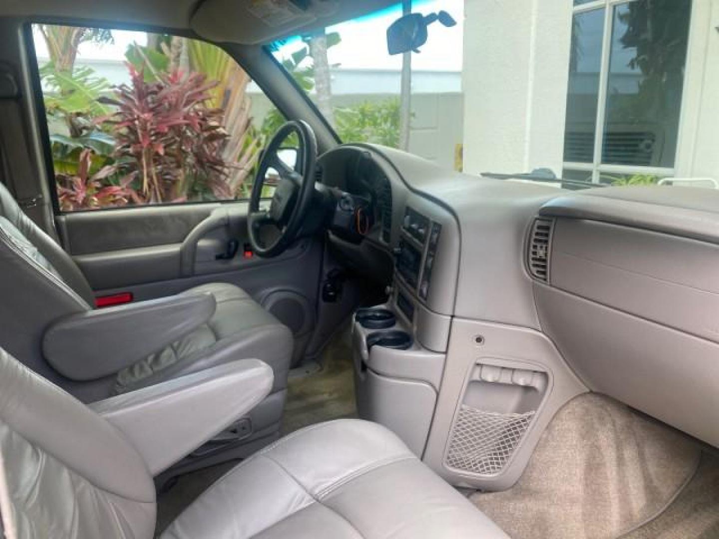 2004 Pewter Metallic /Medium Gray GMC Safari Passenger AWD LOW MILES 84,154 (1GKEL19X34B) with an 4.3L Vortec 4300 V6 MFI Engine engine, Automatic transmission, located at 4701 North Dixie Hwy, Pompano Beach, FL, 33064, (954) 422-2889, 26.240938, -80.123474 - OUR WEBPAGE FLORIDACARS1.COM HAS OVER 100 PHOTOS AND FREE CARFAX LINK 2004 GMC SAFARI VIN: 1GKEL19X34B502356 1 G K E L 1 9 X 3 4 B 5 0 2 3 5 6 VAN 4.3L V6 F GASOLINE ALL WHEEL DRIVE Features 4WD/AWD ABS Brakes Air Conditioning AM/FM Stereo Automatic Transmission Cassette Player CD Audio Convenience - Photo#99