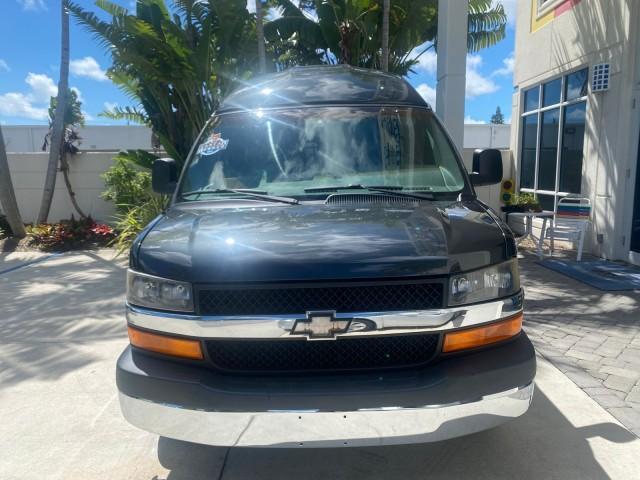 2004 Black /Medium Dark Pewter Chevrolet Express HANDICAP LIFT 1 OWNER FLORIDA HIGH TOP CONV VAN (1GBFG15T441) with an 5.3L Vortec 5300 V8 SFI Engine engine, Automatic transmission, located at 4701 North Dixie Hwy, Pompano Beach, FL, 33064, (954) 422-2889, 26.240938, -80.123474 - OUR WEBPAGE FLORIDACARS1.COM HAS OVER 100 PHOTOS AND FREE CARFAX LINK 2004 CHEVROLET EXPRESS G1500 HIGH TOP CONVERSION VAN WITH HANDICAP RAMP/LIFT VIN: 1GBFG15T441124744 THIS VAN COSTS $85,000 BRAND NEW WITH THE HANDICAP RAMP 1 G B F G 1 5 T 4 4 1 1 2 4 7 4 4 VAN 5.3L V8 F GASOLINE REAR WHEEL DRIVE - Photo#2