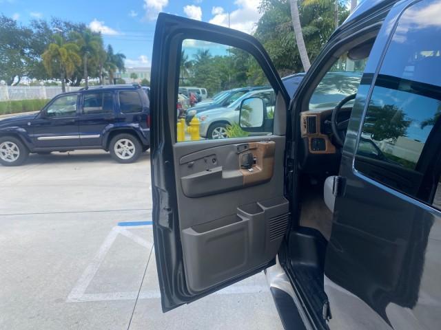2004 Black /Medium Dark Pewter Chevrolet Express HANDICAP LIFT 1 OWNER FLORIDA HIGH TOP CONV VAN (1GBFG15T441) with an 5.3L Vortec 5300 V8 SFI Engine engine, Automatic transmission, located at 4701 North Dixie Hwy, Pompano Beach, FL, 33064, (954) 422-2889, 26.240938, -80.123474 - OUR WEBPAGE FLORIDACARS1.COM HAS OVER 100 PHOTOS AND FREE CARFAX LINK 2004 CHEVROLET EXPRESS G1500 HIGH TOP CONVERSION VAN WITH HANDICAP RAMP/LIFT VIN: 1GBFG15T441124744 THIS VAN COSTS $85,000 BRAND NEW WITH THE HANDICAP RAMP 1 G B F G 1 5 T 4 4 1 1 2 4 7 4 4 VAN 5.3L V8 F GASOLINE REAR WHEEL DRIVE - Photo#9