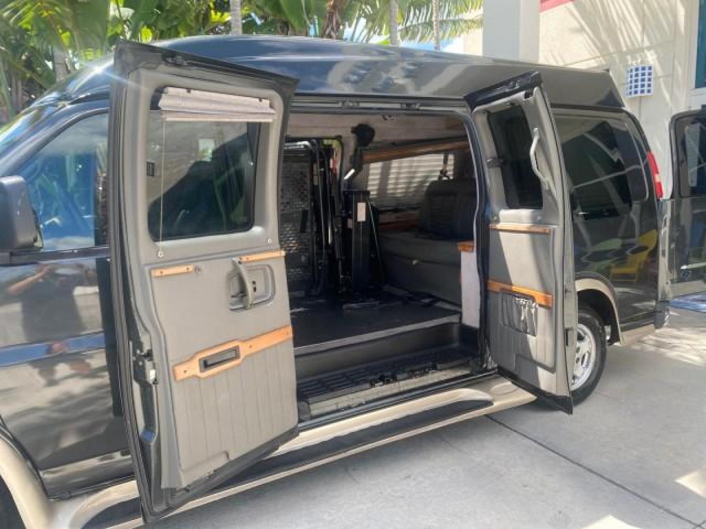 2004 Black /Medium Dark Pewter Chevrolet Express HANDICAP LIFT 1 OWNER FLORIDA HIGH TOP CONV VAN (1GBFG15T441) with an 5.3L Vortec 5300 V8 SFI Engine engine, Automatic transmission, located at 4701 North Dixie Hwy, Pompano Beach, FL, 33064, (954) 422-2889, 26.240938, -80.123474 - OUR WEBPAGE FLORIDACARS1.COM HAS OVER 100 PHOTOS AND FREE CARFAX LINK 2004 CHEVROLET EXPRESS G1500 HIGH TOP CONVERSION VAN WITH HANDICAP RAMP/LIFT VIN: 1GBFG15T441124744 THIS VAN COSTS $85,000 BRAND NEW WITH THE HANDICAP RAMP 1 G B F G 1 5 T 4 4 1 1 2 4 7 4 4 VAN 5.3L V8 F GASOLINE REAR WHEEL DRIVE - Photo#13