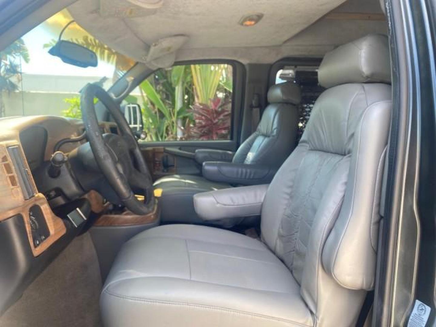 2004 Black /Medium Dark Pewter Chevrolet Express HANDICAP LIFT 1 OWNER FLORIDA HIGH TOP CONV VAN (1GBFG15T441) with an 5.3L Vortec 5300 V8 SFI Engine engine, Automatic transmission, located at 4701 North Dixie Hwy, Pompano Beach, FL, 33064, (954) 422-2889, 26.240938, -80.123474 - OUR WEBPAGE FLORIDACARS1.COM HAS OVER 100 PHOTOS AND FREE CARFAX LINK 2004 CHEVROLET EXPRESS G1500 HIGH TOP CONVERSION VAN WITH HANDICAP RAMP/LIFT VIN: 1GBFG15T441124744 THIS VAN COSTS $85,000 BRAND NEW WITH THE HANDICAP RAMP 1 G B F G 1 5 T 4 4 1 1 2 4 7 4 4 VAN 5.3L V8 F GASOLINE REAR WHEEL DRIVE - Photo#47