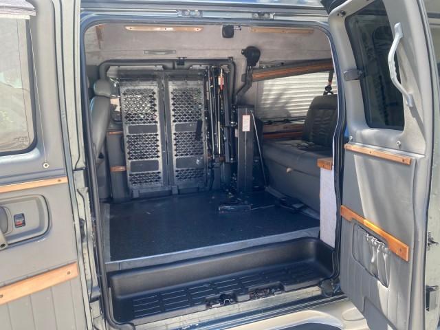 2004 Black /Medium Dark Pewter Chevrolet Express HANDICAP LIFT 1 OWNER FLORIDA HIGH TOP CONV VAN (1GBFG15T441) with an 5.3L Vortec 5300 V8 SFI Engine engine, Automatic transmission, located at 4701 North Dixie Hwy, Pompano Beach, FL, 33064, (954) 422-2889, 26.240938, -80.123474 - OUR WEBPAGE FLORIDACARS1.COM HAS OVER 100 PHOTOS AND FREE CARFAX LINK 2004 CHEVROLET EXPRESS G1500 HIGH TOP CONVERSION VAN WITH HANDICAP RAMP/LIFT VIN: 1GBFG15T441124744 THIS VAN COSTS $85,000 BRAND NEW WITH THE HANDICAP RAMP 1 G B F G 1 5 T 4 4 1 1 2 4 7 4 4 VAN 5.3L V8 F GASOLINE REAR WHEEL DRIVE - Photo#71