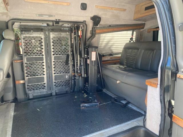 2004 Black /Medium Dark Pewter Chevrolet Express HANDICAP LIFT 1 OWNER FLORIDA HIGH TOP CONV VAN (1GBFG15T441) with an 5.3L Vortec 5300 V8 SFI Engine engine, Automatic transmission, located at 4701 North Dixie Hwy, Pompano Beach, FL, 33064, (954) 422-2889, 26.240938, -80.123474 - OUR WEBPAGE FLORIDACARS1.COM HAS OVER 100 PHOTOS AND FREE CARFAX LINK 2004 CHEVROLET EXPRESS G1500 HIGH TOP CONVERSION VAN WITH HANDICAP RAMP/LIFT VIN: 1GBFG15T441124744 THIS VAN COSTS $85,000 BRAND NEW WITH THE HANDICAP RAMP 1 G B F G 1 5 T 4 4 1 1 2 4 7 4 4 VAN 5.3L V8 F GASOLINE REAR WHEEL DRIVE - Photo#72