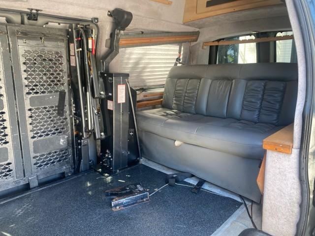 2004 Black /Medium Dark Pewter Chevrolet Express HANDICAP LIFT 1 OWNER FLORIDA HIGH TOP CONV VAN (1GBFG15T441) with an 5.3L Vortec 5300 V8 SFI Engine engine, Automatic transmission, located at 4701 North Dixie Hwy, Pompano Beach, FL, 33064, (954) 422-2889, 26.240938, -80.123474 - OUR WEBPAGE FLORIDACARS1.COM HAS OVER 100 PHOTOS AND FREE CARFAX LINK 2004 CHEVROLET EXPRESS G1500 HIGH TOP CONVERSION VAN WITH HANDICAP RAMP/LIFT VIN: 1GBFG15T441124744 THIS VAN COSTS $85,000 BRAND NEW WITH THE HANDICAP RAMP 1 G B F G 1 5 T 4 4 1 1 2 4 7 4 4 VAN 5.3L V8 F GASOLINE REAR WHEEL DRIVE - Photo#73