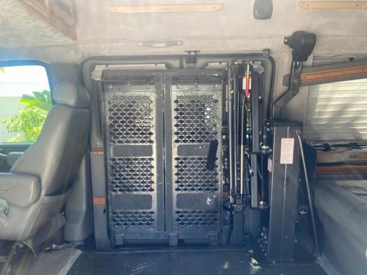 2004 Black /Medium Dark Pewter Chevrolet Express HANDICAP LIFT 1 OWNER FLORIDA HIGH TOP CONV VAN (1GBFG15T441) with an 5.3L Vortec 5300 V8 SFI Engine engine, Automatic transmission, located at 4701 North Dixie Hwy, Pompano Beach, FL, 33064, (954) 422-2889, 26.240938, -80.123474 - OUR WEBPAGE FLORIDACARS1.COM HAS OVER 100 PHOTOS AND FREE CARFAX LINK 2004 CHEVROLET EXPRESS G1500 HIGH TOP CONVERSION VAN WITH HANDICAP RAMP/LIFT VIN: 1GBFG15T441124744 THIS VAN COSTS $85,000 BRAND NEW WITH THE HANDICAP RAMP 1 G B F G 1 5 T 4 4 1 1 2 4 7 4 4 VAN 5.3L V8 F GASOLINE REAR WHEEL DRIVE - Photo#74