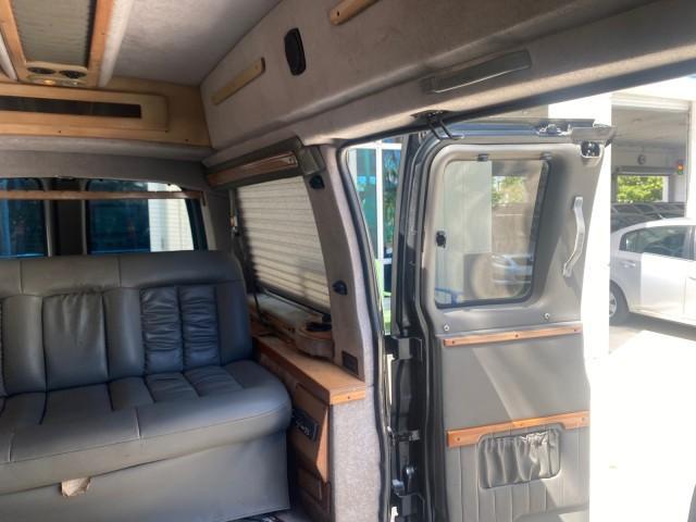 2004 Black /Medium Dark Pewter Chevrolet Express HANDICAP LIFT 1 OWNER FLORIDA HIGH TOP CONV VAN (1GBFG15T441) with an 5.3L Vortec 5300 V8 SFI Engine engine, Automatic transmission, located at 4701 North Dixie Hwy, Pompano Beach, FL, 33064, (954) 422-2889, 26.240938, -80.123474 - OUR WEBPAGE FLORIDACARS1.COM HAS OVER 100 PHOTOS AND FREE CARFAX LINK 2004 CHEVROLET EXPRESS G1500 HIGH TOP CONVERSION VAN WITH HANDICAP RAMP/LIFT VIN: 1GBFG15T441124744 THIS VAN COSTS $85,000 BRAND NEW WITH THE HANDICAP RAMP 1 G B F G 1 5 T 4 4 1 1 2 4 7 4 4 VAN 5.3L V8 F GASOLINE REAR WHEEL DRIVE - Photo#82