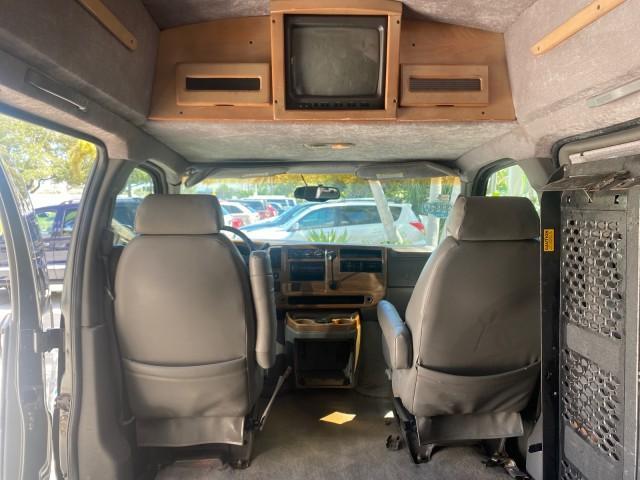 2004 Black /Medium Dark Pewter Chevrolet Express HANDICAP LIFT 1 OWNER FLORIDA HIGH TOP CONV VAN (1GBFG15T441) with an 5.3L Vortec 5300 V8 SFI Engine engine, Automatic transmission, located at 4701 North Dixie Hwy, Pompano Beach, FL, 33064, (954) 422-2889, 26.240938, -80.123474 - OUR WEBPAGE FLORIDACARS1.COM HAS OVER 100 PHOTOS AND FREE CARFAX LINK 2004 CHEVROLET EXPRESS G1500 HIGH TOP CONVERSION VAN WITH HANDICAP RAMP/LIFT VIN: 1GBFG15T441124744 THIS VAN COSTS $85,000 BRAND NEW WITH THE HANDICAP RAMP 1 G B F G 1 5 T 4 4 1 1 2 4 7 4 4 VAN 5.3L V8 F GASOLINE REAR WHEEL DRIVE - Photo#84