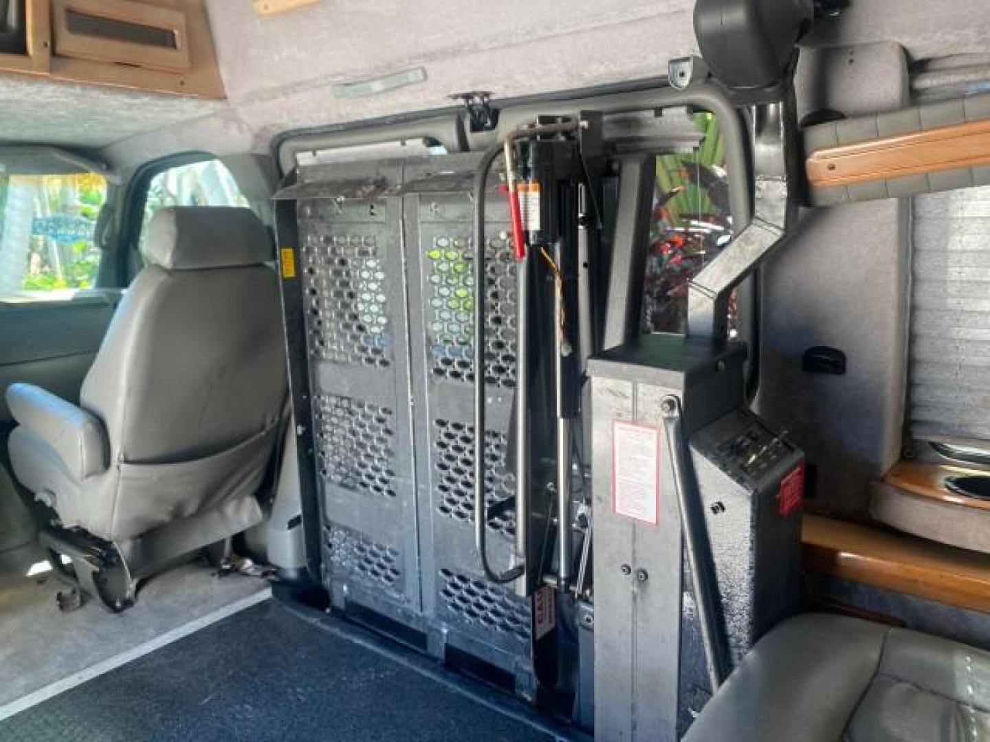 2004 Black /Medium Dark Pewter Chevrolet Express HANDICAP LIFT 1 OWNER FLORIDA HIGH TOP CONV VAN (1GBFG15T441) with an 5.3L Vortec 5300 V8 SFI Engine engine, Automatic transmission, located at 4701 North Dixie Hwy, Pompano Beach, FL, 33064, (954) 422-2889, 26.240938, -80.123474 - OUR WEBPAGE FLORIDACARS1.COM HAS OVER 100 PHOTOS AND FREE CARFAX LINK 2004 CHEVROLET EXPRESS G1500 HIGH TOP CONVERSION VAN WITH HANDICAP RAMP/LIFT VIN: 1GBFG15T441124744 THIS VAN COSTS $85,000 BRAND NEW WITH THE HANDICAP RAMP 1 G B F G 1 5 T 4 4 1 1 2 4 7 4 4 VAN 5.3L V8 F GASOLINE REAR WHEEL DRIVE - Photo#86