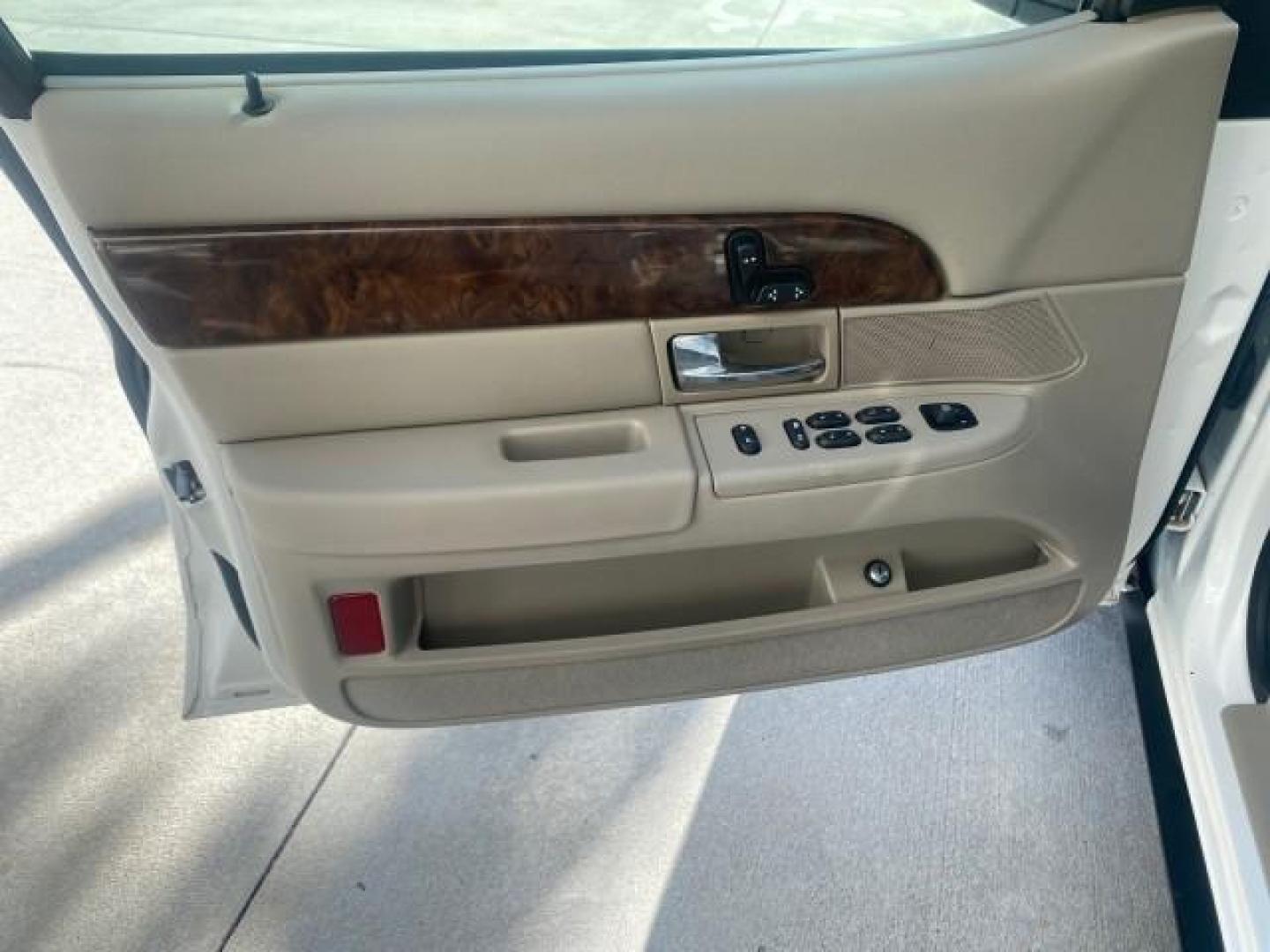 2007 Vibrant White /Med Light Stone Mercury Grand Marquis LS LOW MILES 62,205 (2MEFM75V17X) with an 4.6L SOHC FFV V8 Engine engine, Automatic transmission, located at 4701 North Dixie Hwy, Pompano Beach, FL, 33064, (954) 422-2889, 26.240938, -80.123474 - OUR WEBPAGE FLORIDACARS1.COM HAS OVER 100 PHOTOS AND FREE CARFAX LINK 2007 MERCURY GRAND MARQUIS LS VIN: 2MEFM75V17X635847 2 M E F M 7 5 V 1 7 X 6 3 5 8 4 7 SEDAN 4 DR 4.6L V8 F SOHC FLEX FUEL REAR WHEEL DRIVE Features ABS Brakes Air Conditioning Alloy Wheels AM/FM Stereo Automatic Transmission Cass - Photo#42