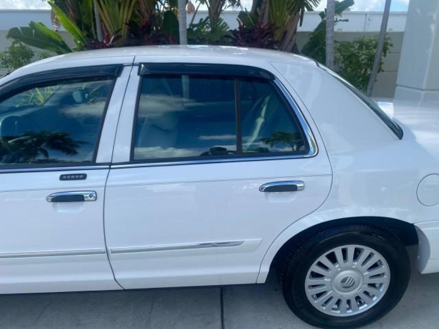 2007 Vibrant White /Med Light Stone Mercury Grand Marquis LS LOW MILES 62,205 (2MEFM75V17X) with an 4.6L SOHC FFV V8 Engine engine, Automatic transmission, located at 4701 North Dixie Hwy, Pompano Beach, FL, 33064, (954) 422-2889, 26.240938, -80.123474 - OUR WEBPAGE FLORIDACARS1.COM HAS OVER 100 PHOTOS AND FREE CARFAX LINK 2007 MERCURY GRAND MARQUIS LS VIN: 2MEFM75V17X635847 2 M E F M 7 5 V 1 7 X 6 3 5 8 4 7 SEDAN 4 DR 4.6L V8 F SOHC FLEX FUEL REAR WHEEL DRIVE Features ABS Brakes Air Conditioning Alloy Wheels AM/FM Stereo Automatic Transmission Cass - Photo#68