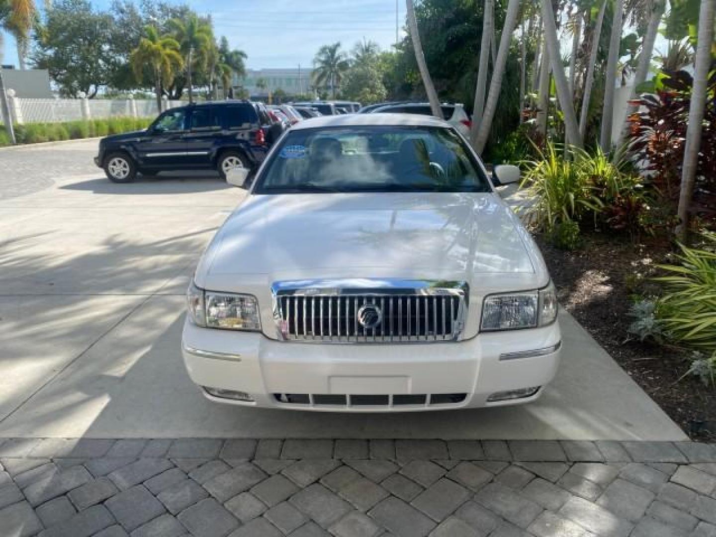 2007 Vibrant White /Med Light Stone Mercury Grand Marquis LS LOW MILES 62,205 (2MEFM75V17X) with an 4.6L SOHC FFV V8 Engine engine, Automatic transmission, located at 4701 North Dixie Hwy, Pompano Beach, FL, 33064, (954) 422-2889, 26.240938, -80.123474 - OUR WEBPAGE FLORIDACARS1.COM HAS OVER 100 PHOTOS AND FREE CARFAX LINK 2007 MERCURY GRAND MARQUIS LS VIN: 2MEFM75V17X635847 2 M E F M 7 5 V 1 7 X 6 3 5 8 4 7 SEDAN 4 DR 4.6L V8 F SOHC FLEX FUEL REAR WHEEL DRIVE Features ABS Brakes Air Conditioning Alloy Wheels AM/FM Stereo Automatic Transmission Cass - Photo#95