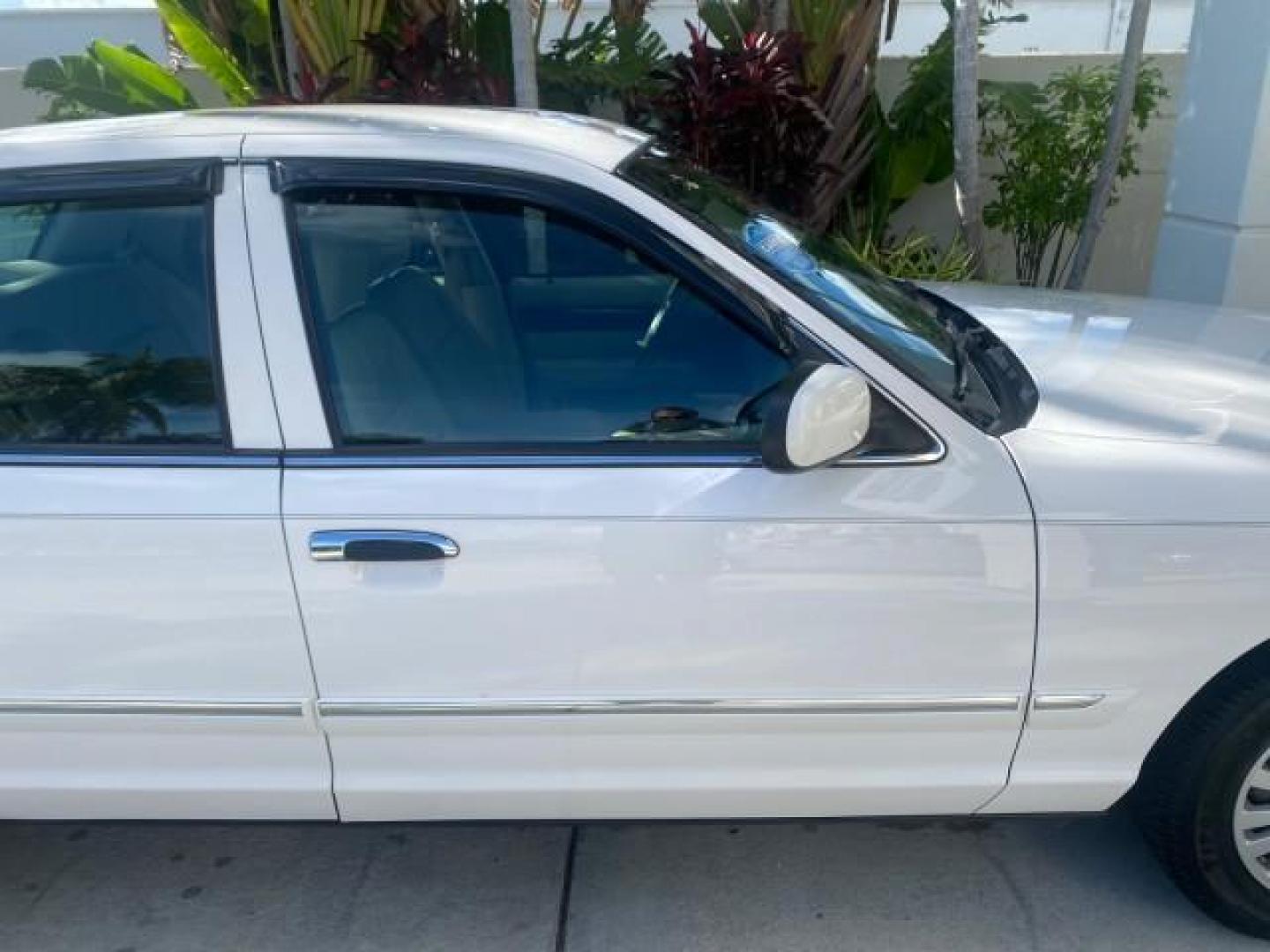 2007 Vibrant White /Med Light Stone Mercury Grand Marquis LS LOW MILES 62,205 (2MEFM75V17X) with an 4.6L SOHC FFV V8 Engine engine, Automatic transmission, located at 4701 North Dixie Hwy, Pompano Beach, FL, 33064, (954) 422-2889, 26.240938, -80.123474 - OUR WEBPAGE FLORIDACARS1.COM HAS OVER 100 PHOTOS AND FREE CARFAX LINK 2007 MERCURY GRAND MARQUIS LS VIN: 2MEFM75V17X635847 2 M E F M 7 5 V 1 7 X 6 3 5 8 4 7 SEDAN 4 DR 4.6L V8 F SOHC FLEX FUEL REAR WHEEL DRIVE Features ABS Brakes Air Conditioning Alloy Wheels AM/FM Stereo Automatic Transmission Cass - Photo#99