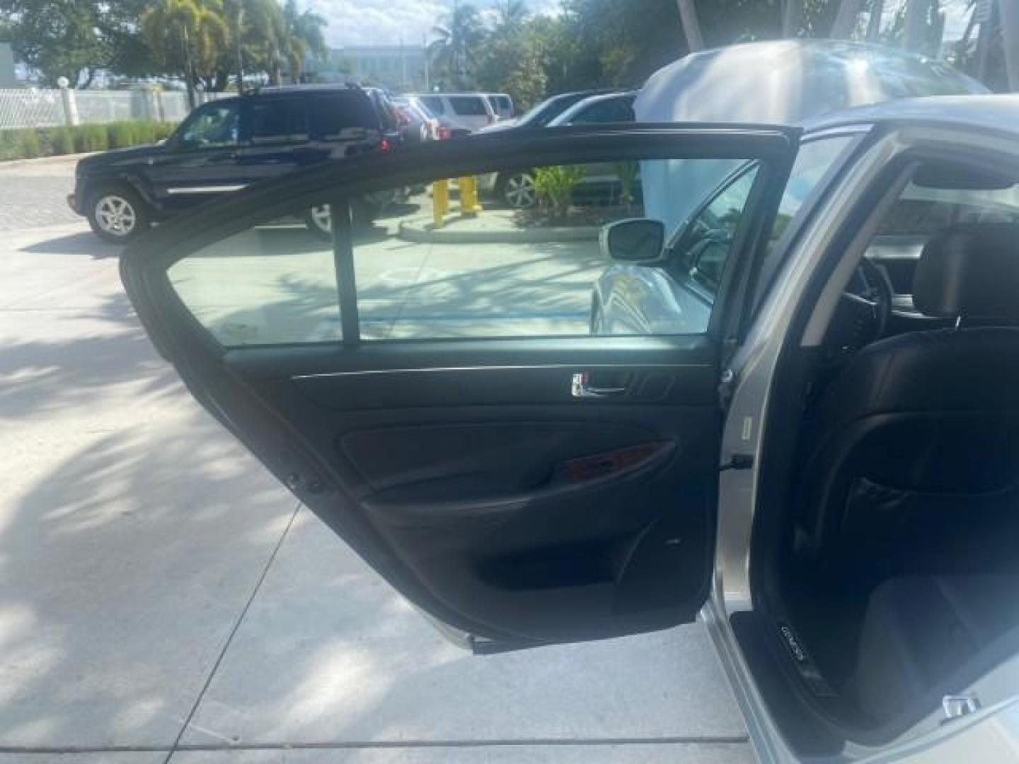 2010 Platinum Metallic /Jet black Hyundai Genesis LOW MILES 32,920 SUNROOF (KMHGC4DF8AU) with an 4.6L DOHC V8 Engine engine, Automatic transmission, located at 4701 North Dixie Hwy, Pompano Beach, FL, 33064, (954) 422-2889, 26.240938, -80.123474 - OUR WEBPAGE FLORIDACARS1.COM HAS OVER 100 PHOTOS AND FREE CARFAX LINK 2010 HYUNDAI GENESIS 4.6L V8 VIN: KMHGC4DF8AU101658 K M H G C 4 D F 8 A U 1 0 1 6 5 8 SEDAN 4 DR 4.6L V8 F DOHC 32V GASOLINE REAR WHEEL DRIVE Features A/C Seat(s) ABS Brakes Air Conditioning Alloy Wheels AM/FM Stereo Automated Cru - Photo#13