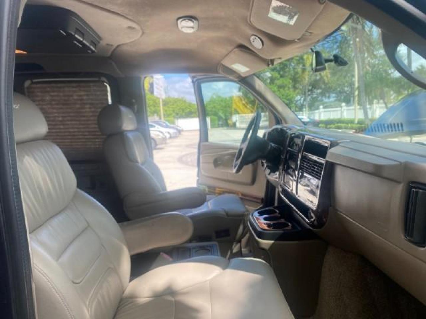 2005 Dark Blue Metallic /Neutral Chevrolet Express Van HANDICAP LIFT CONV LOW MILES 40,837 (1GBFG15T151) with an 5.3L Vortec 5300 V8 SFI Engine engine, Automatic transmission, located at 4701 North Dixie Hwy, Pompano Beach, FL, 33064, (954) 422-2889, 26.240938, -80.123474 - OUR WEBPAGE FLORIDACARS1.COM HAS OVER 100 PHOTOS AND FREE CARFAX LINK 2005 CHEVROLET REGENCY EXPRESS G1500 $20,000 - Conversion Van VIN: 1GBFG15T151226679 $20,000 - Handicap Lift $70,000 - NEW CHEVROLET REGENCY VAN 1 G B F G 1 5 T 1 5 1 2 2 6 6 7 9 VAN 5.3L V8 F GASOLINE REAR WHEEL DRIVE Features AB - Photo#12