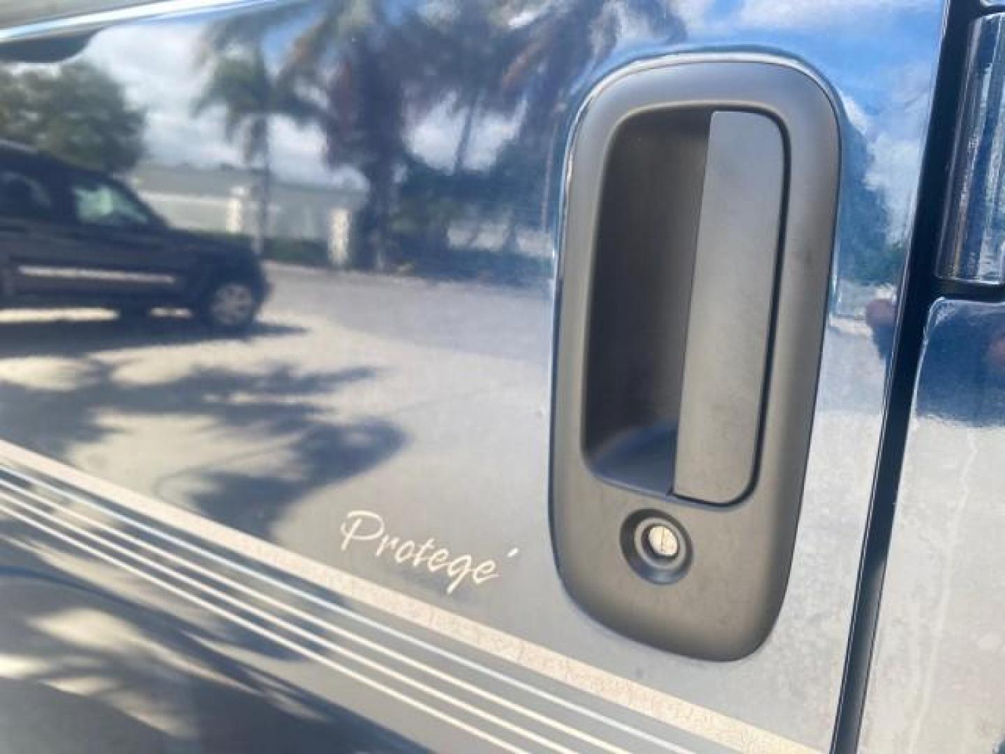 2005 Dark Blue Metallic /Neutral Chevrolet Express Van HANDICAP LIFT CONV LOW MILES 40,837 (1GBFG15T151) with an 5.3L Vortec 5300 V8 SFI Engine engine, Automatic transmission, located at 4701 North Dixie Hwy, Pompano Beach, FL, 33064, (954) 422-2889, 26.240938, -80.123474 - OUR WEBPAGE FLORIDACARS1.COM HAS OVER 100 PHOTOS AND FREE CARFAX LINK 2005 CHEVROLET REGENCY EXPRESS G1500 $20,000 - Conversion Van VIN: 1GBFG15T151226679 $20,000 - Handicap Lift $70,000 - NEW CHEVROLET REGENCY VAN 1 G B F G 1 5 T 1 5 1 2 2 6 6 7 9 VAN 5.3L V8 F GASOLINE REAR WHEEL DRIVE Features AB - Photo#40