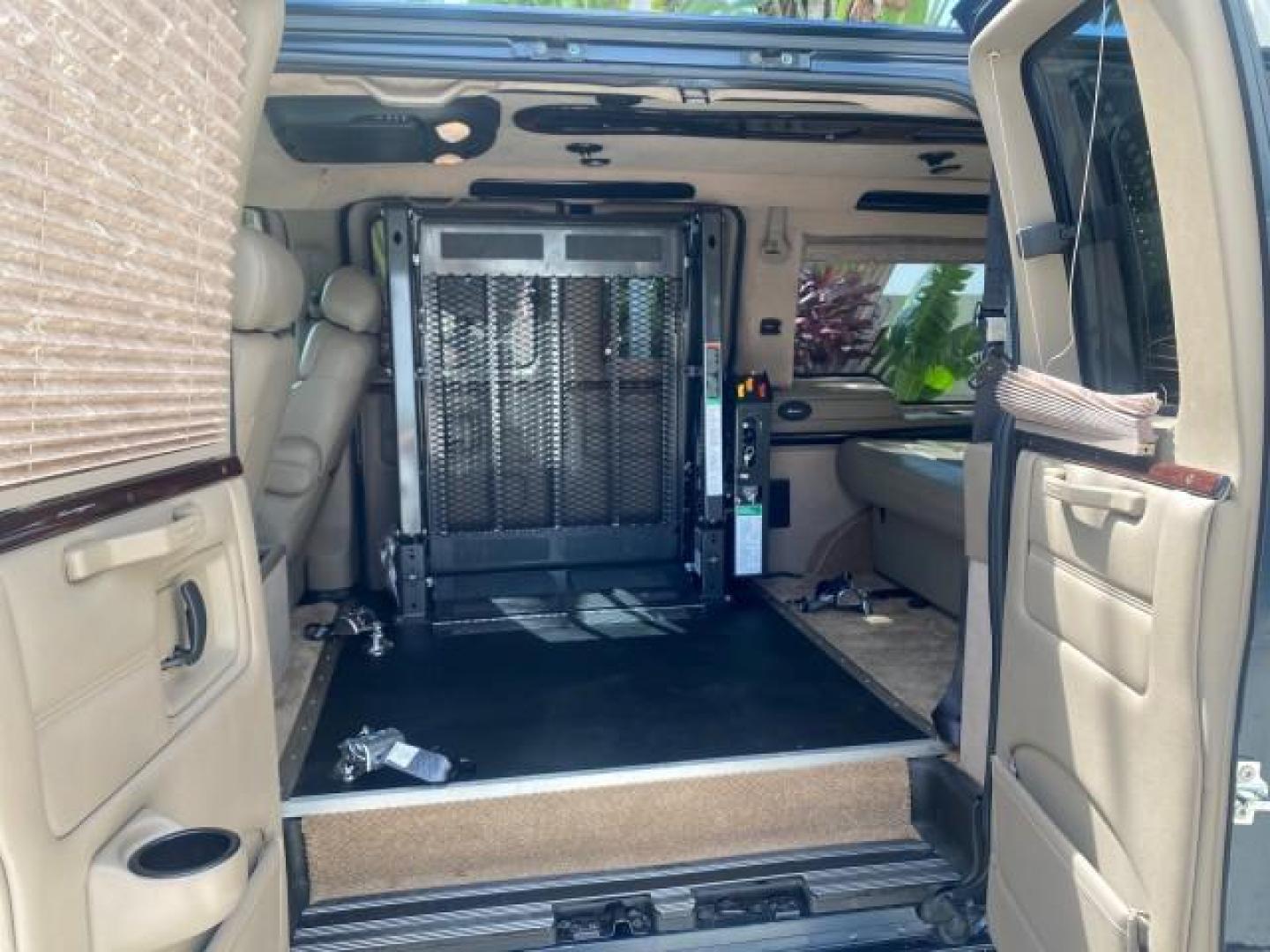 2005 Dark Blue Metallic /Neutral Chevrolet Express Van HANDICAP LIFT CONV LOW MILES 40,837 (1GBFG15T151) with an 5.3L Vortec 5300 V8 SFI Engine engine, Automatic transmission, located at 4701 North Dixie Hwy, Pompano Beach, FL, 33064, (954) 422-2889, 26.240938, -80.123474 - OUR WEBPAGE FLORIDACARS1.COM HAS OVER 100 PHOTOS AND FREE CARFAX LINK 2005 CHEVROLET REGENCY EXPRESS G1500 $20,000 - Conversion Van VIN: 1GBFG15T151226679 $20,000 - Handicap Lift $70,000 - NEW CHEVROLET REGENCY VAN 1 G B F G 1 5 T 1 5 1 2 2 6 6 7 9 VAN 5.3L V8 F GASOLINE REAR WHEEL DRIVE Features AB - Photo#74