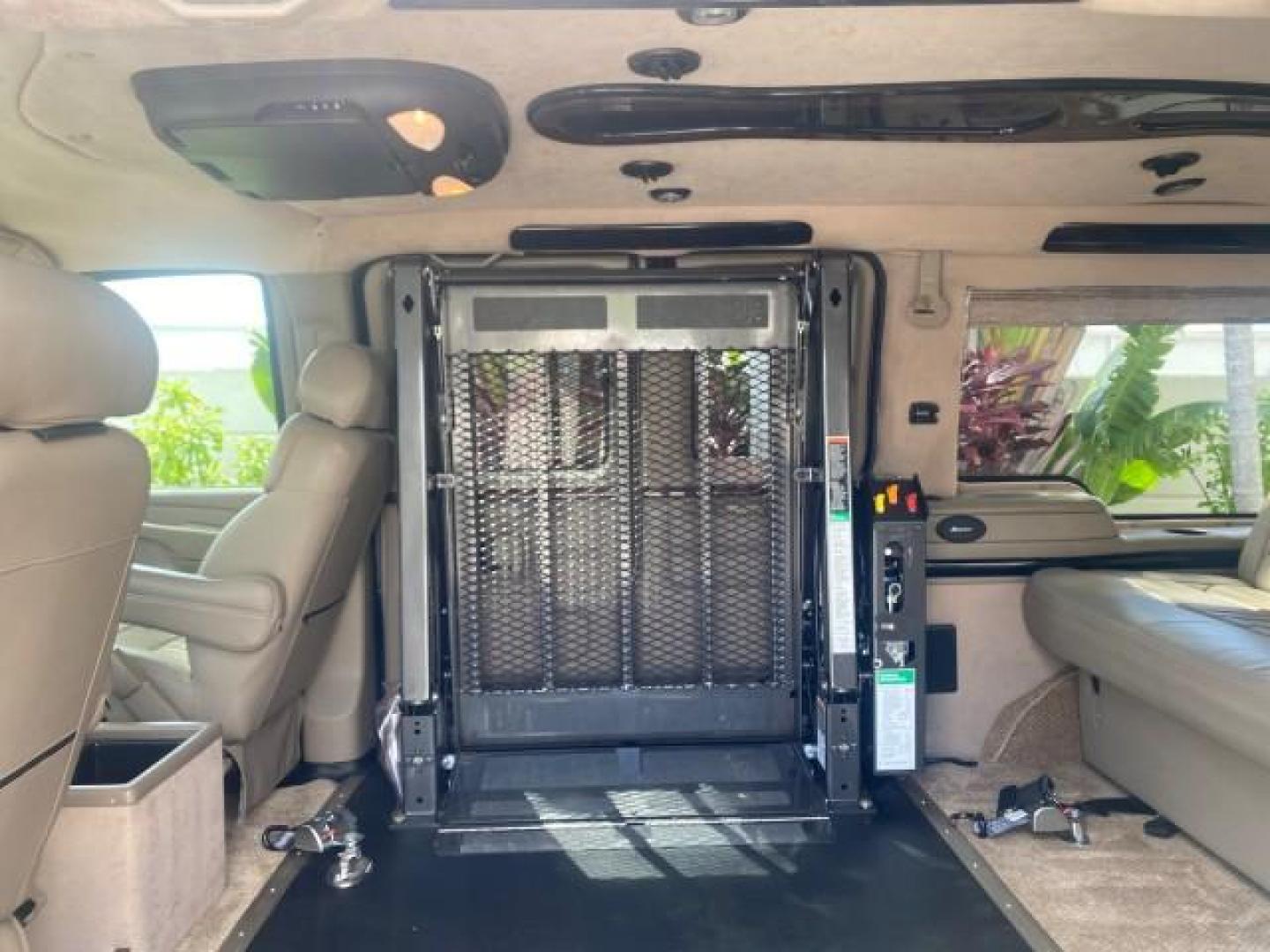 2005 Dark Blue Metallic /Neutral Chevrolet Express Van HANDICAP LIFT CONV LOW MILES 40,837 (1GBFG15T151) with an 5.3L Vortec 5300 V8 SFI Engine engine, Automatic transmission, located at 4701 North Dixie Hwy, Pompano Beach, FL, 33064, (954) 422-2889, 26.240938, -80.123474 - OUR WEBPAGE FLORIDACARS1.COM HAS OVER 100 PHOTOS AND FREE CARFAX LINK 2005 CHEVROLET REGENCY EXPRESS G1500 $20,000 - Conversion Van VIN: 1GBFG15T151226679 $20,000 - Handicap Lift $70,000 - NEW CHEVROLET REGENCY VAN 1 G B F G 1 5 T 1 5 1 2 2 6 6 7 9 VAN 5.3L V8 F GASOLINE REAR WHEEL DRIVE Features AB - Photo#75